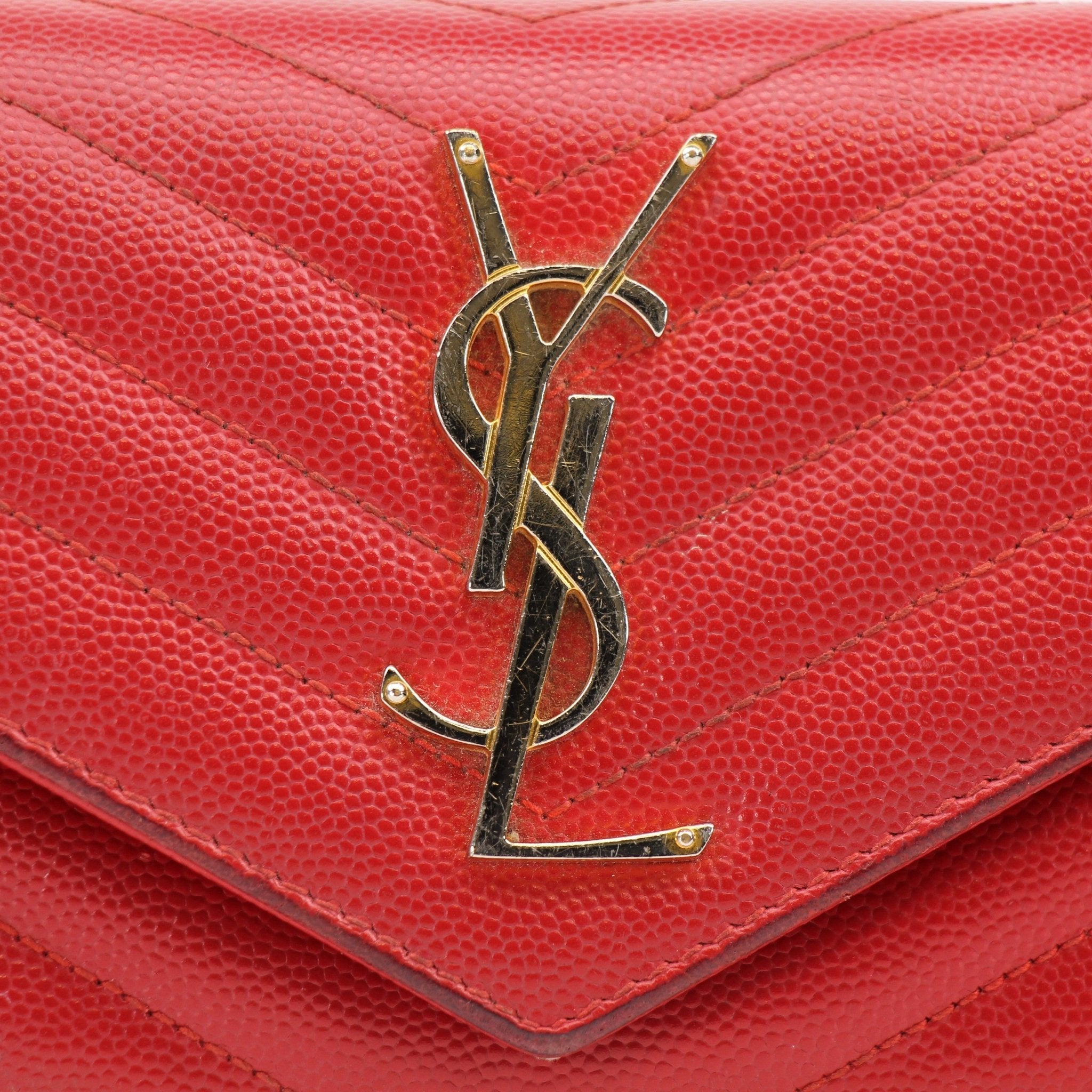 Gold & Beyond Saint Laurent red envelope chain wallet with flap, featuring a stylish compact design and gold-tone chain detail.