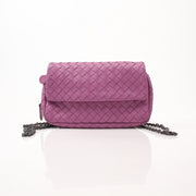 Gold & Beyond Bottega Veneta expandable chain flap handbag with leather and metal details, stylish and versatile accessory.