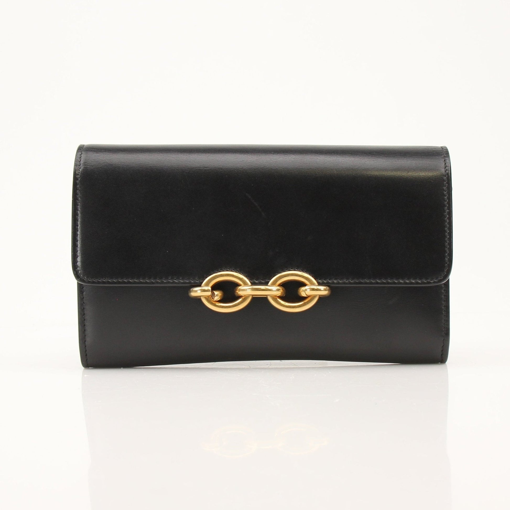 Gold & Beyond Saint Laurent wallet on chain with gold hardware and black leather, showcasing a sleek, compact design.