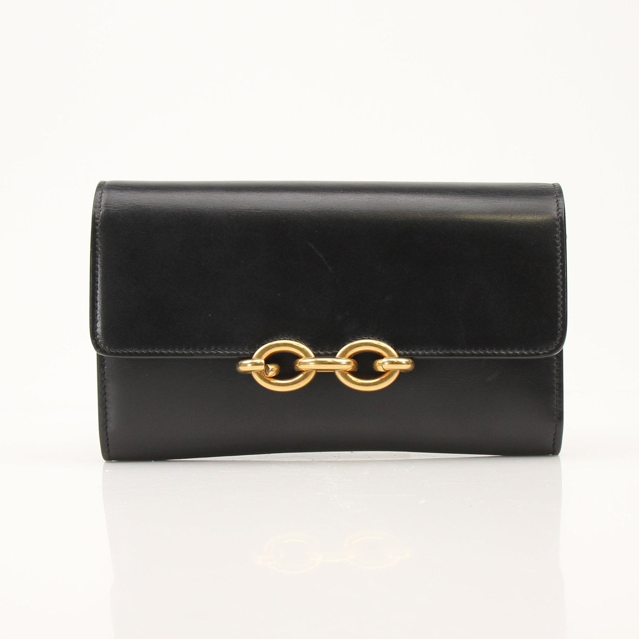 Gold & Beyond Saint Laurent wallet on chain with gold hardware and black leather, showcasing a sleek, compact design.