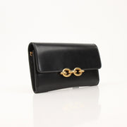 Gold & Beyond Saint Laurent Wallet on Chain, elegant black leather wallet with chain strap and gold-tone hardware.