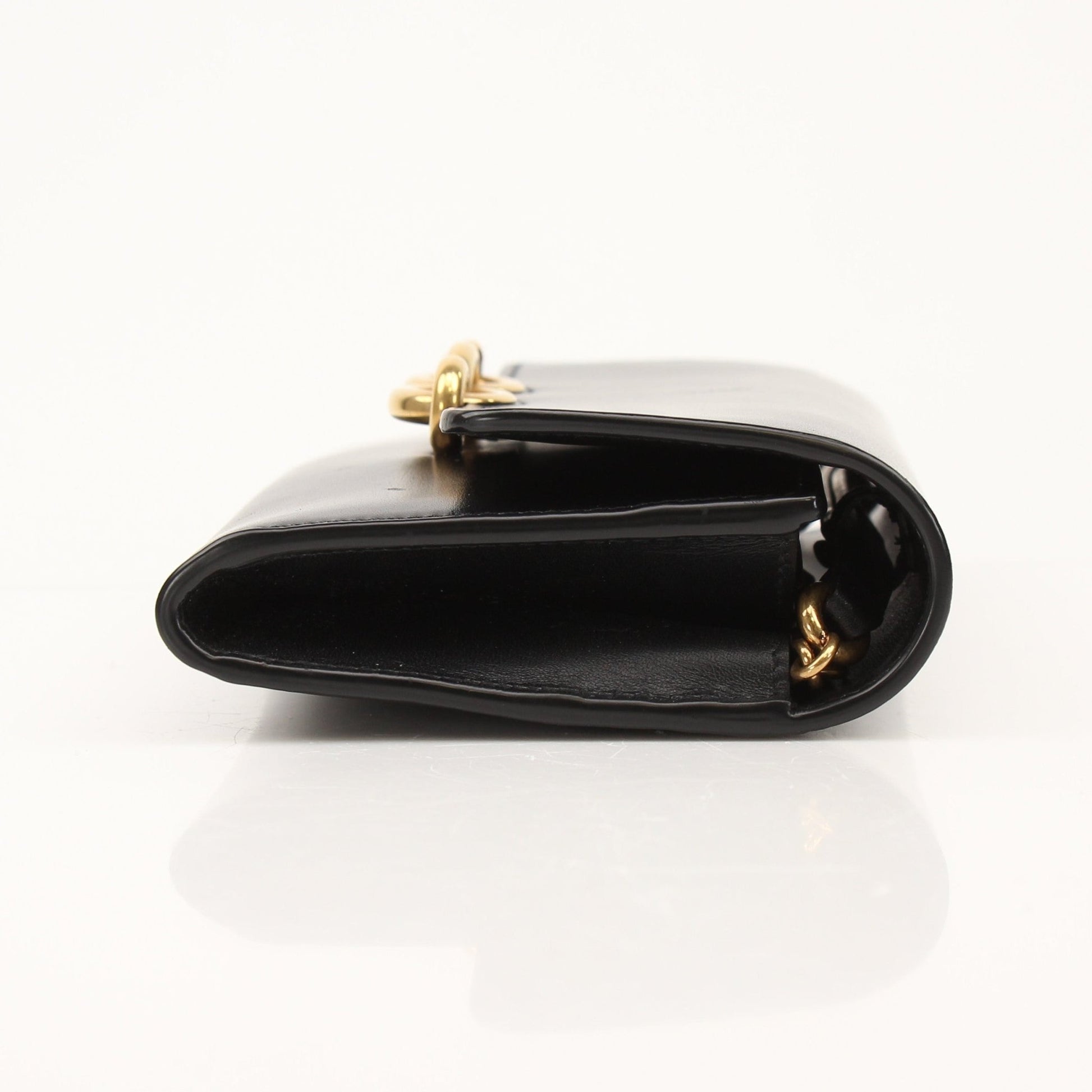 Gold & Beyond Saint Laurent Wallet on Chain with gold-tone hardware and sleek leather design.