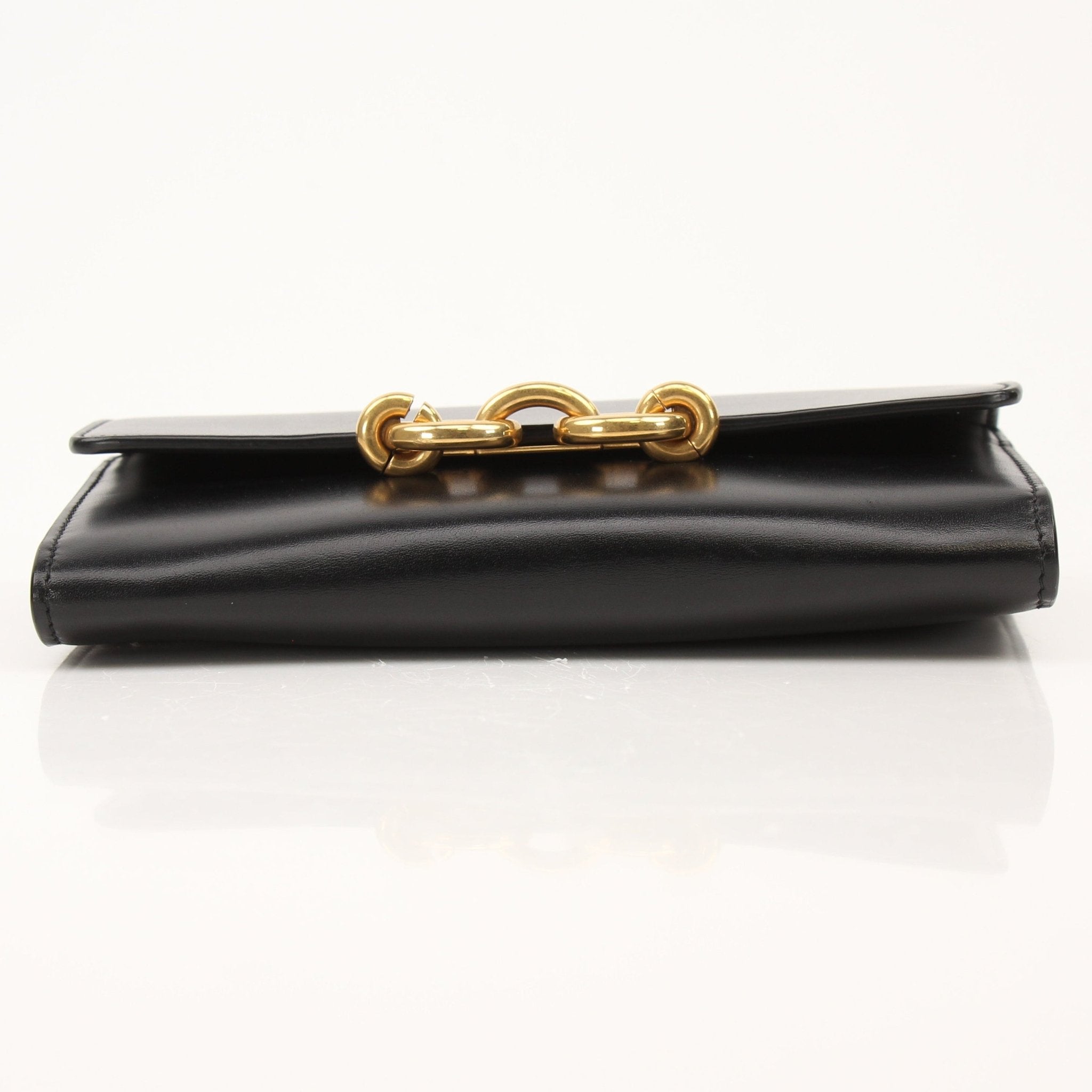 Gold & Beyond Saint Laurent wallet on chain, stylish leather wallet featuring chain strap and compact design.