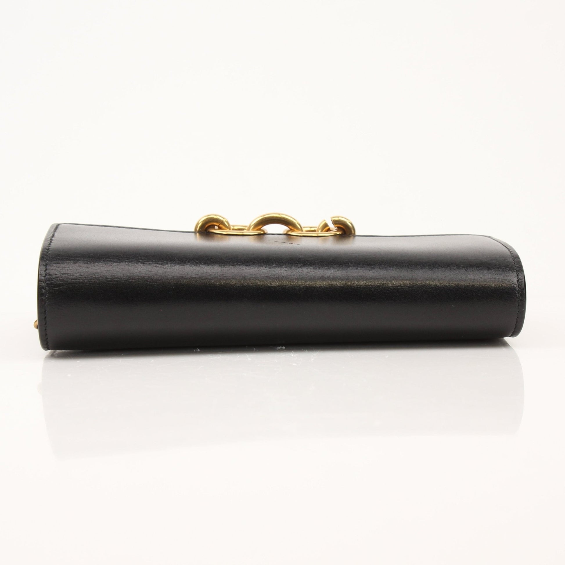 Gold & Beyond Saint Laurent wallet on chain, compact black leather wallet with gold chain strap and signature YSL logo detail.