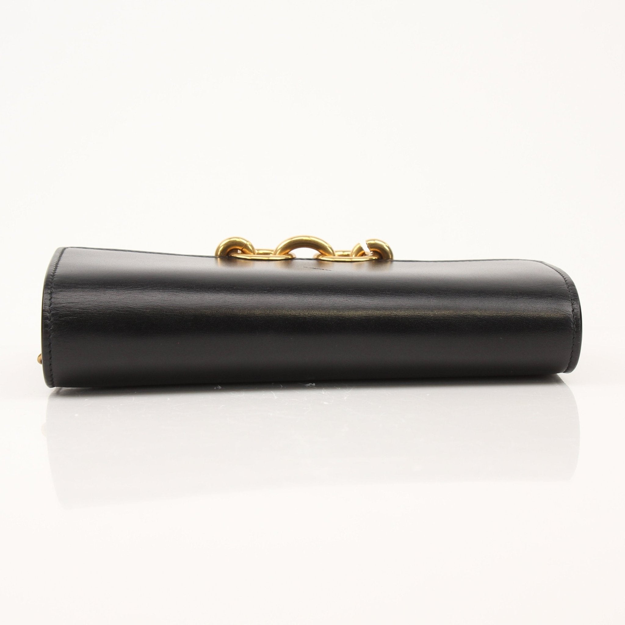 Gold & Beyond Saint Laurent wallet on chain, compact black leather wallet with gold chain strap and signature YSL logo detail.