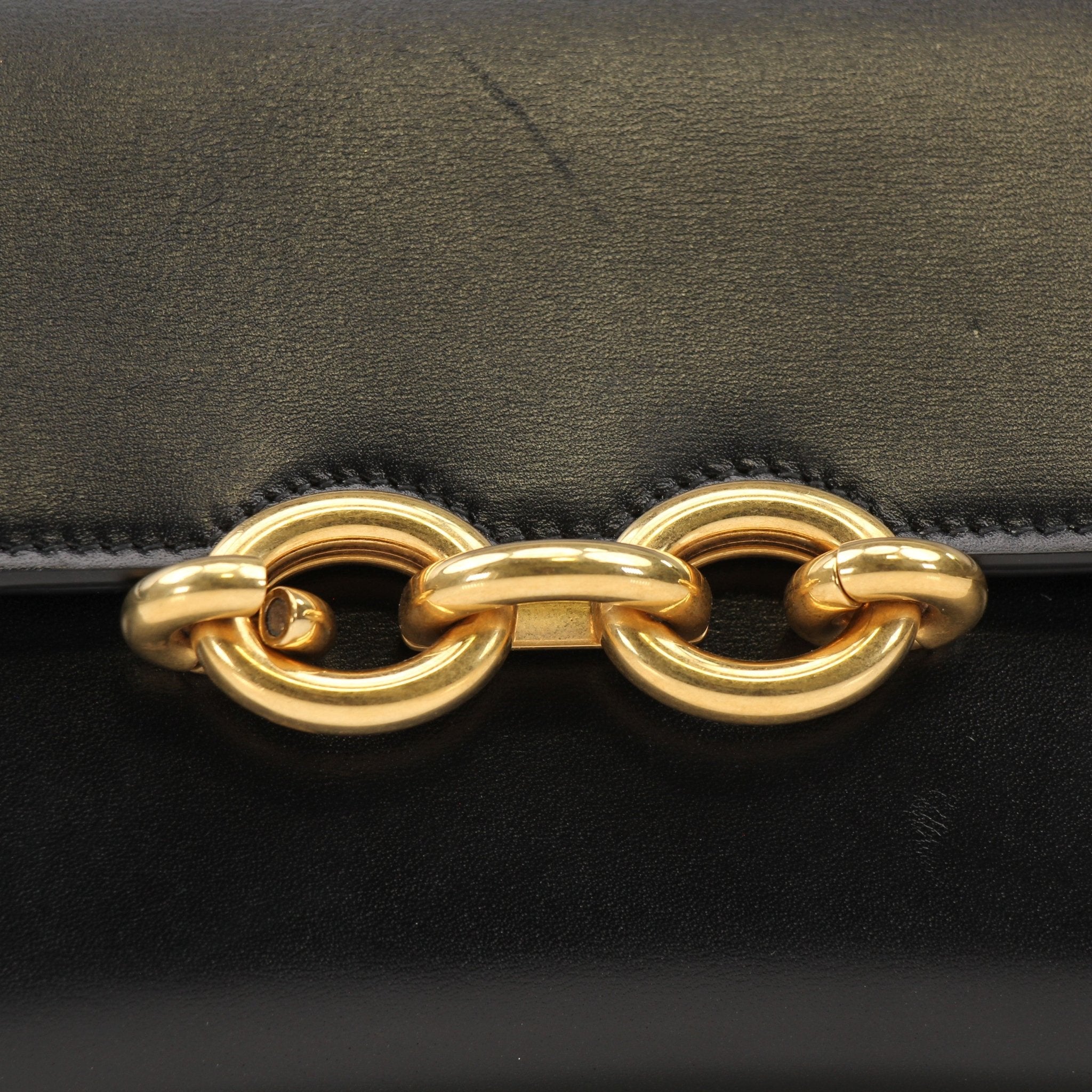 Gold & Beyond Saint Laurent Wallet on Chain with gold-tone hardware and classic black leather wallet design.
