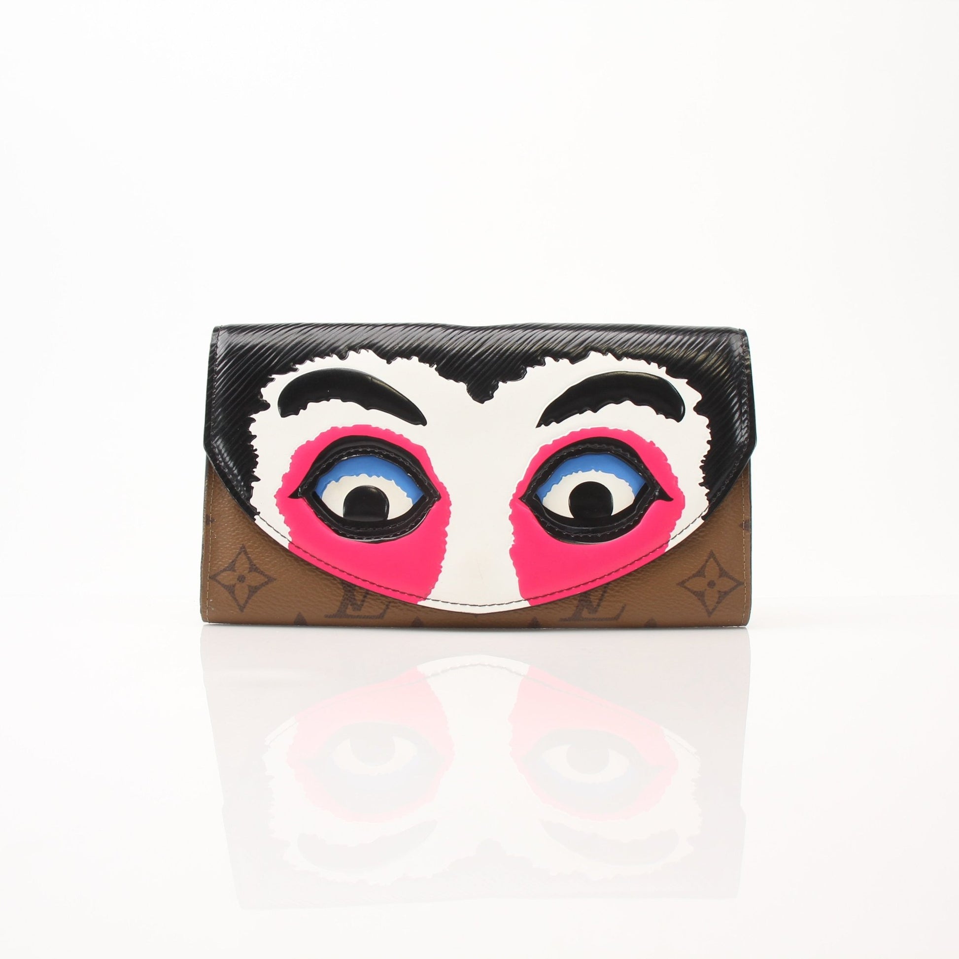 Louis Vuitton Sarah Kabuki wallet by Gold & Beyond with gold accents, showcasing its elegant design and compact size.