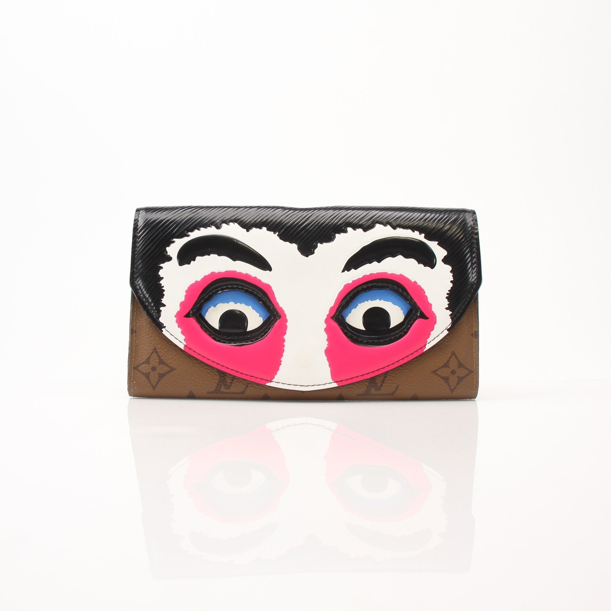 Louis Vuitton Sarah Kabuki wallet by Gold & Beyond with gold accents, showcasing its elegant design and compact size.