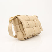 Gold & Beyond Bottega Veneta padded Cassette handbag with quilted leather and signature woven design.