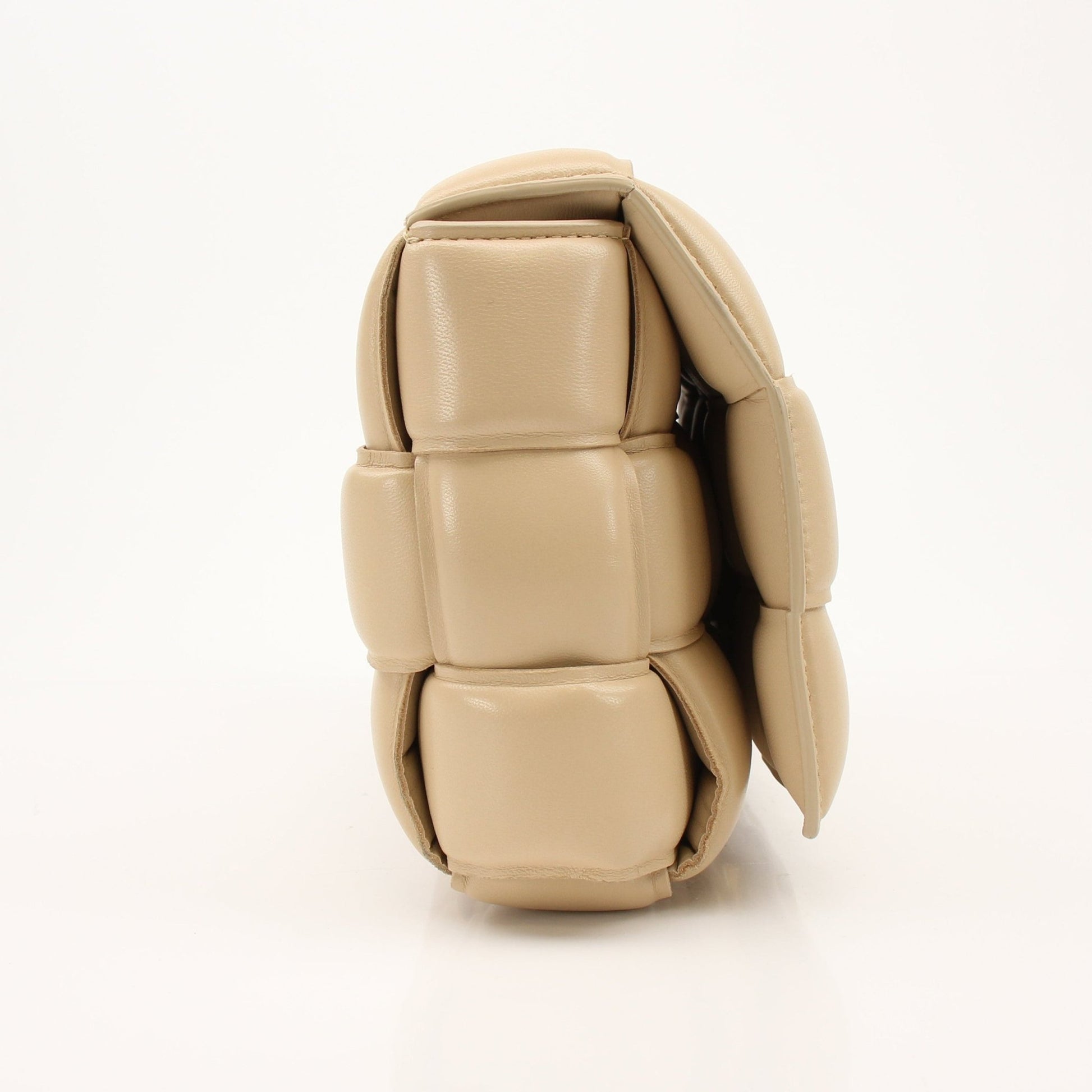 Gold & Beyond Bottega Veneta Padded Cassette handbag with textured leather and gold-tone hardware, displayed on a neutral background.