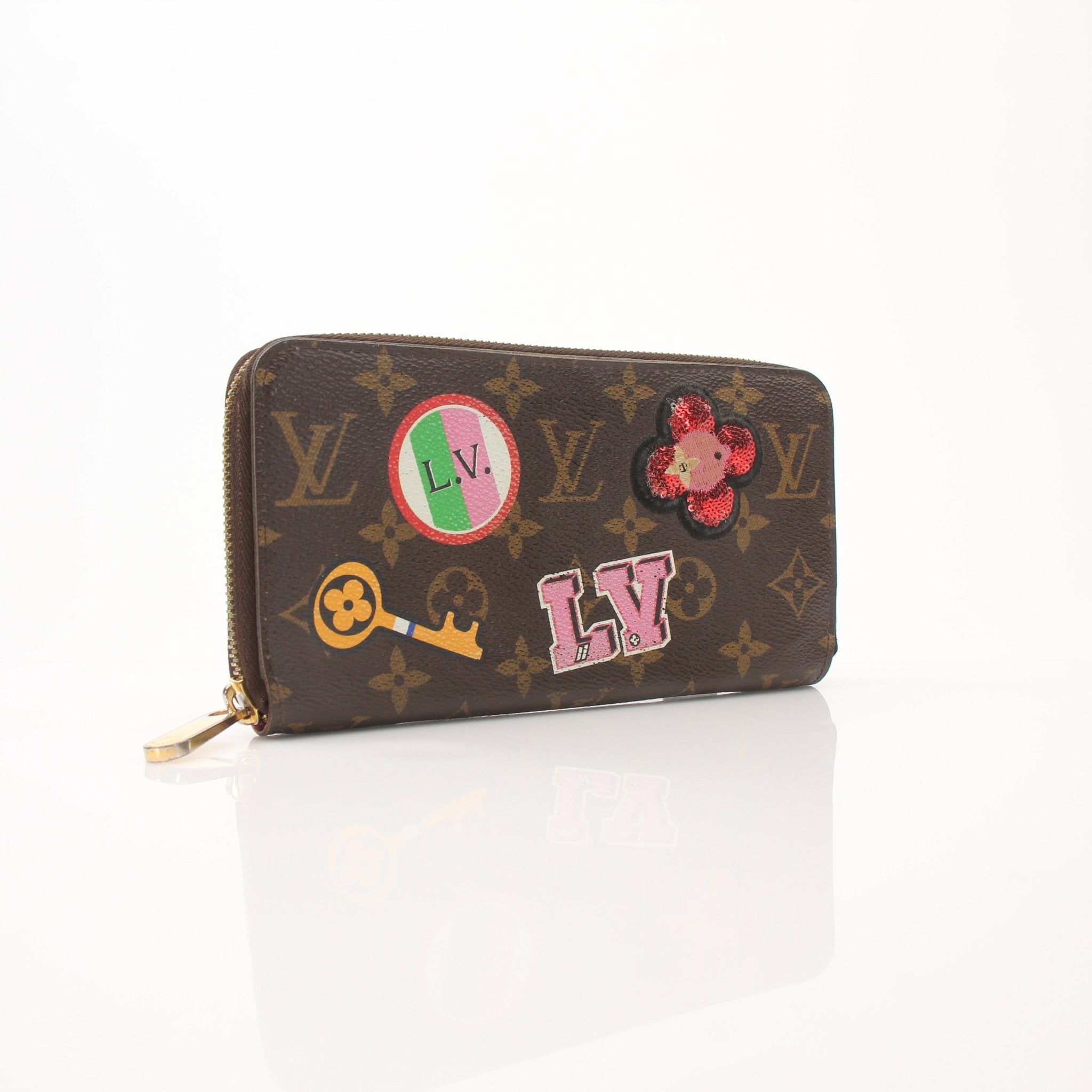 Louis Vuitton LV Stories Zippy Wallet by Gold & Beyond, featuring the signature monogram pattern and gold-tone zipper closure.