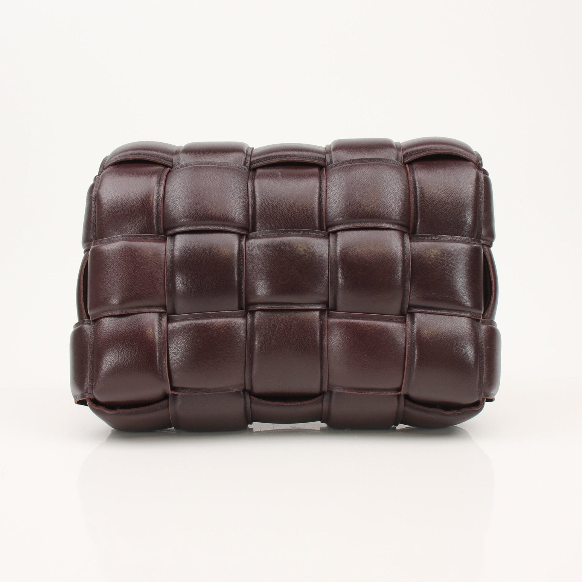 Gold & Beyond Bottega Veneta Padded Cassette Bag handbag with signature intrecciato design and padded leather texture.