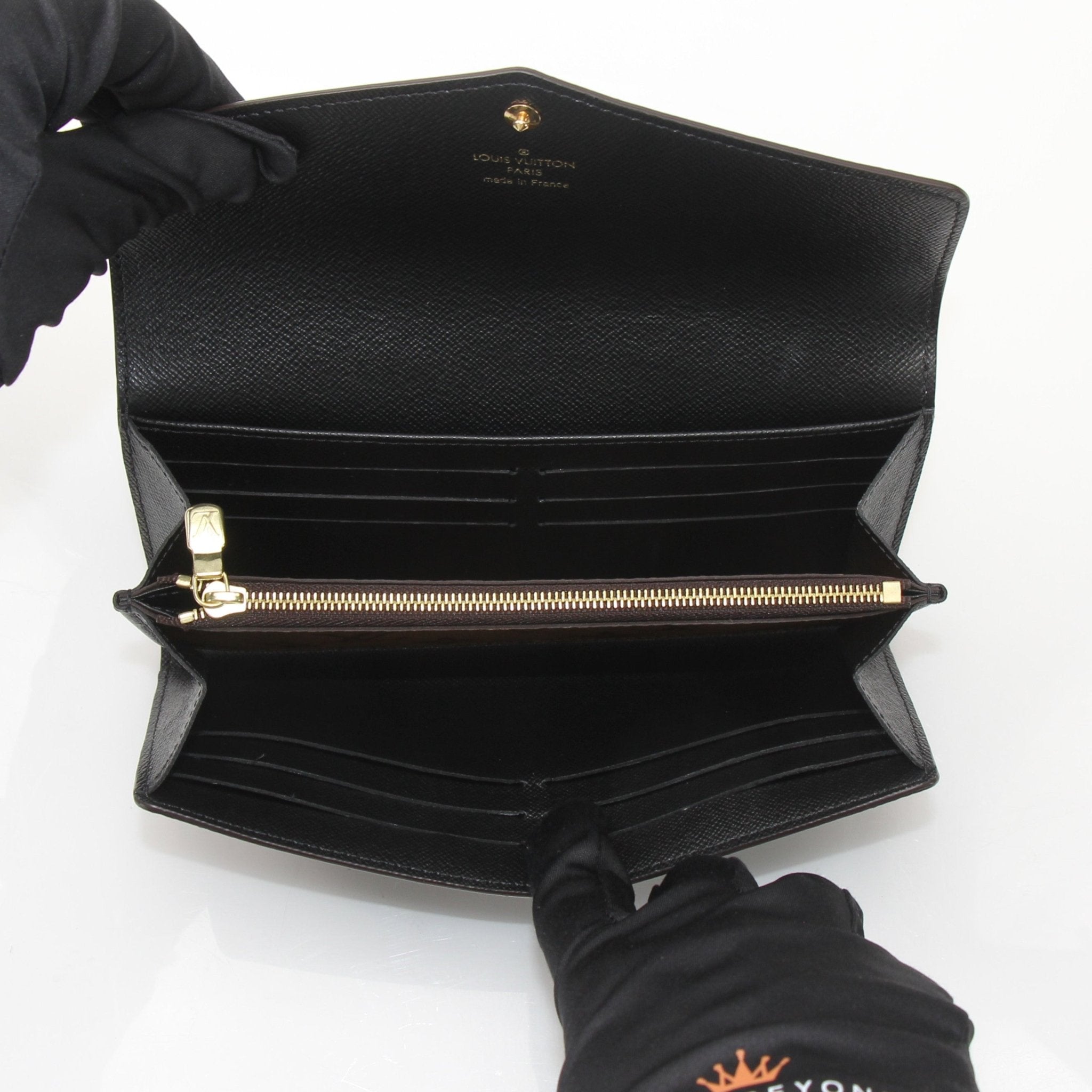 Louis Vuitton Reverse Monogram Wallet by Gold & Beyond, showcasing the distinctive monogram design and compact, stylish wallet features.