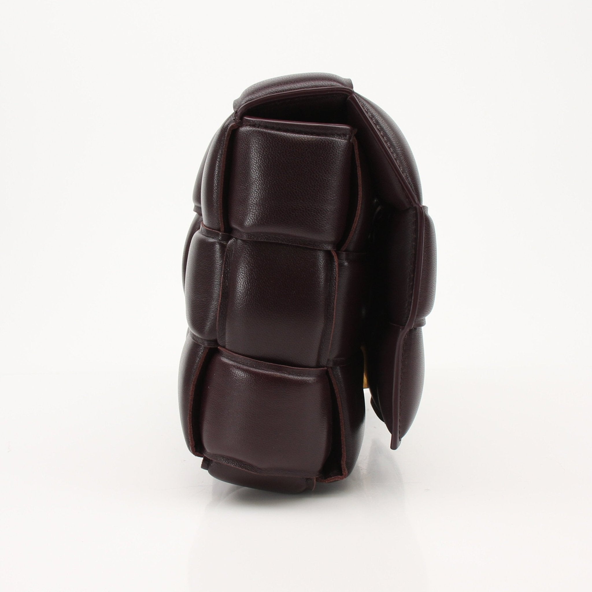 Gold & Beyond Bottega Veneta Padded Cassette Bag handbag with sleek design and padded leather, displayed on a neutral background.