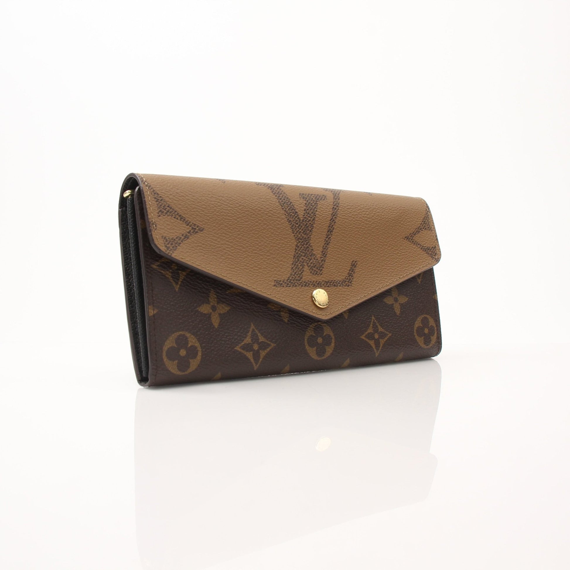 Louis Vuitton Reverse Monogram Wallet with gold accents, showcasing the signature monogram pattern and compact design.