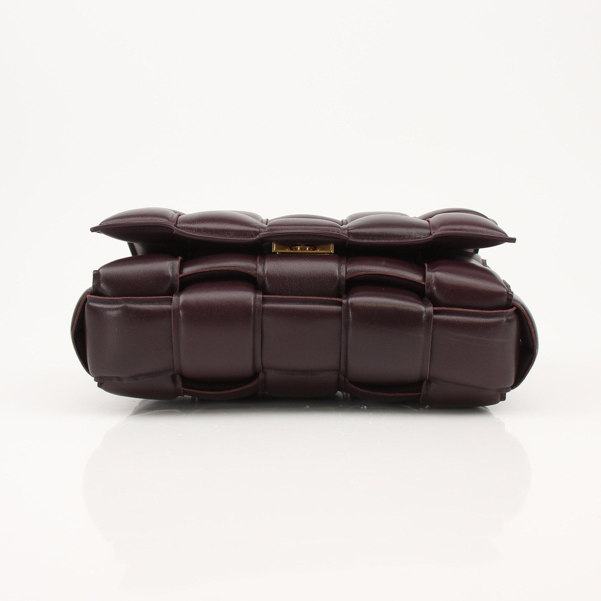 Gold & Beyond Bottega Veneta Padded Cassette Bag handbag with padded leather and signature design, shown on a plain background.