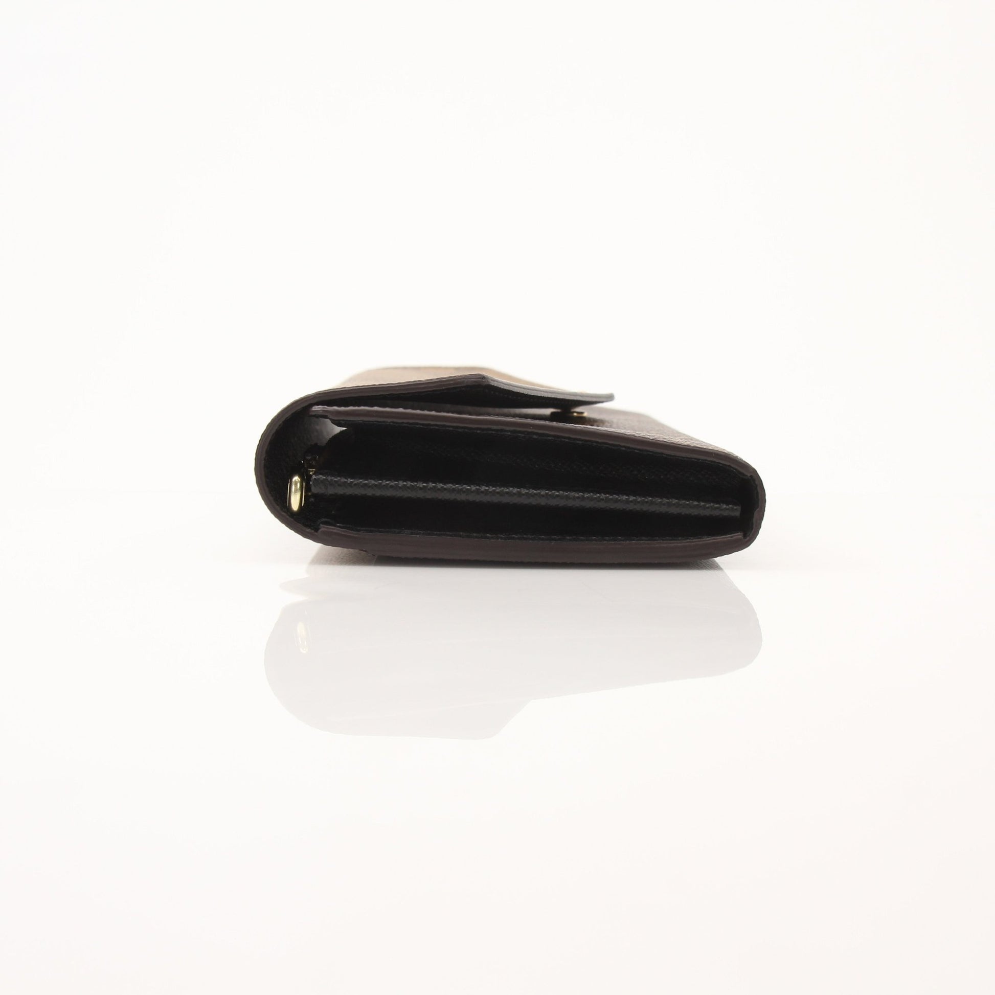 Louis Vuitton Reverse Monogram Wallet by Gold & Beyond, featuring the iconic patterned leather and compact wallet design.