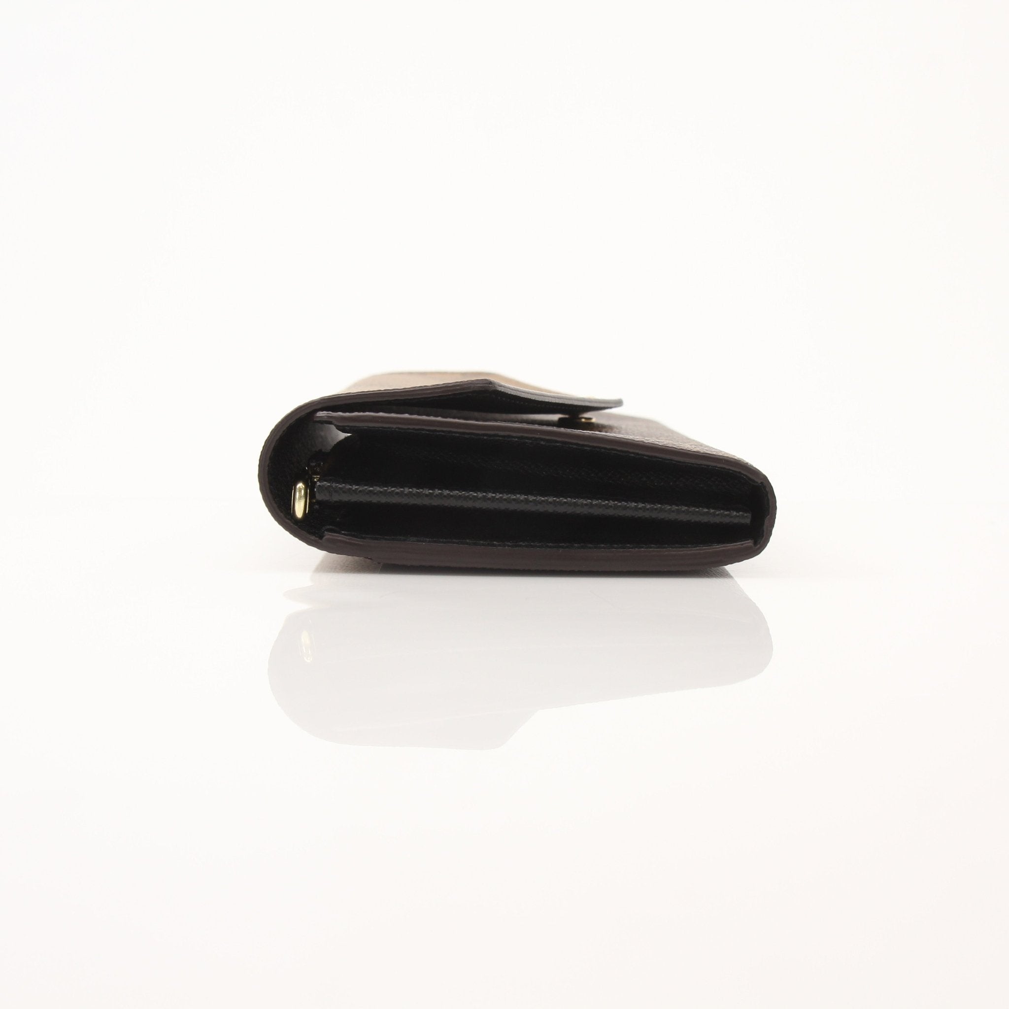 Louis Vuitton Reverse Monogram Wallet by Gold & Beyond, featuring the iconic patterned leather and compact wallet design.
