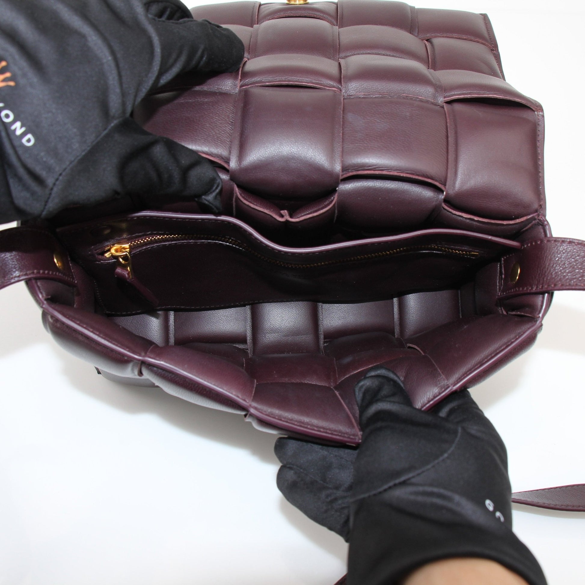 Gold & Beyond Bottega Veneta Padded Cassette Bag handbag with padded leather design and silver hardware, front view.