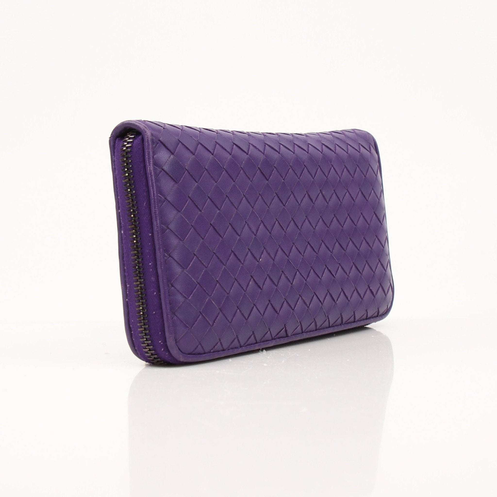 Gold & Beyond Bottega Veneta zip around wallet with leather exterior and interior card slots, stylish and functional accessory.