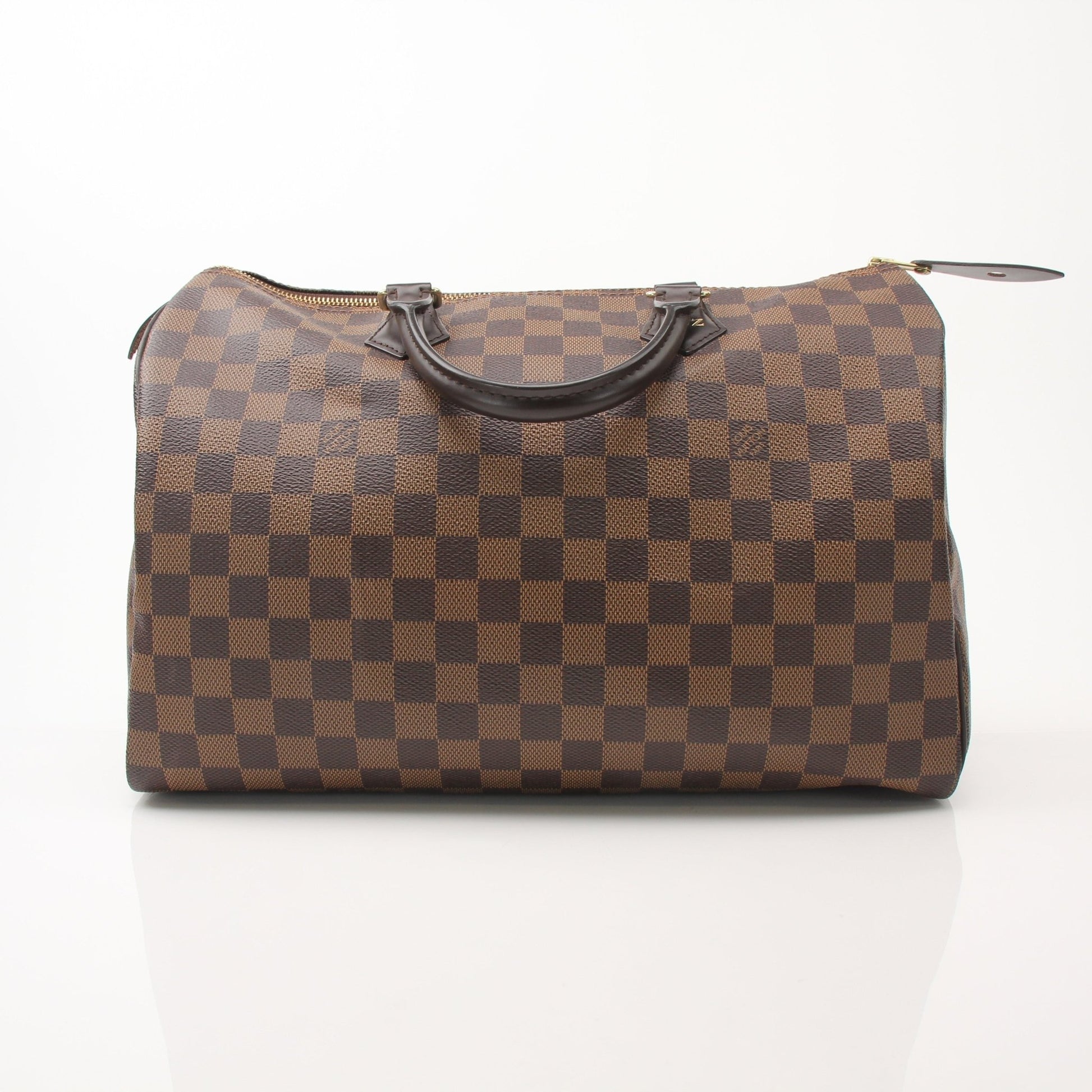 Louis Vuitton Speedy 35 handbag in classic monogram canvas with leather handles and gold-tone hardware.