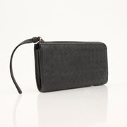 Black Bottega Veneta Intrecciato leather wallet with subtle branding, showcasing woven craftsmanship and sleek design.