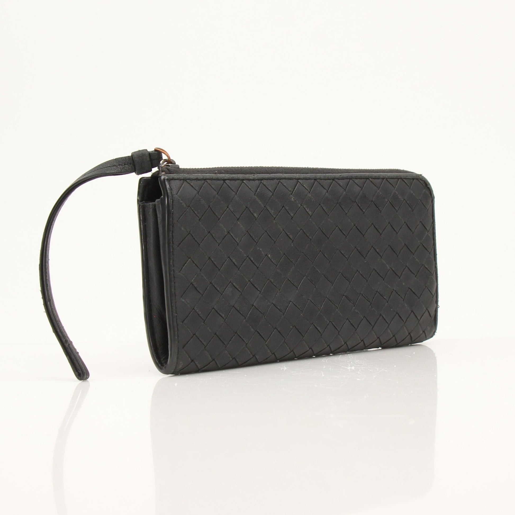 Black Bottega Veneta Intrecciato leather wallet with subtle branding, showcasing woven craftsmanship and sleek design.
