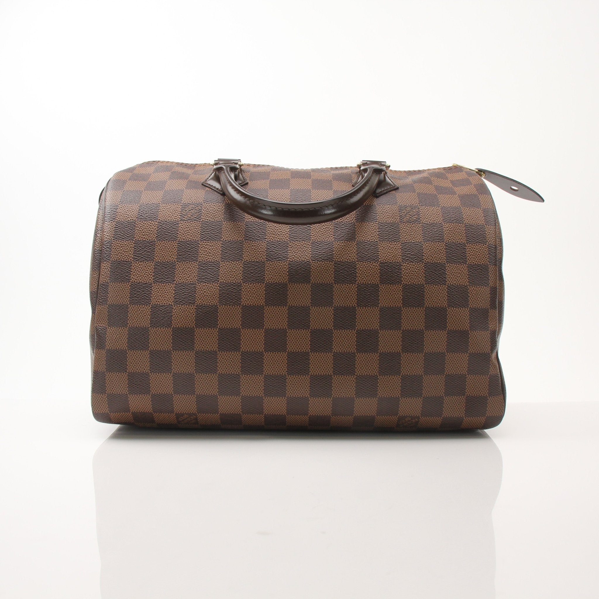 Louis Vuitton Speedy 30 handbag with gold hardware and monogram canvas, displayed on a neutral background.