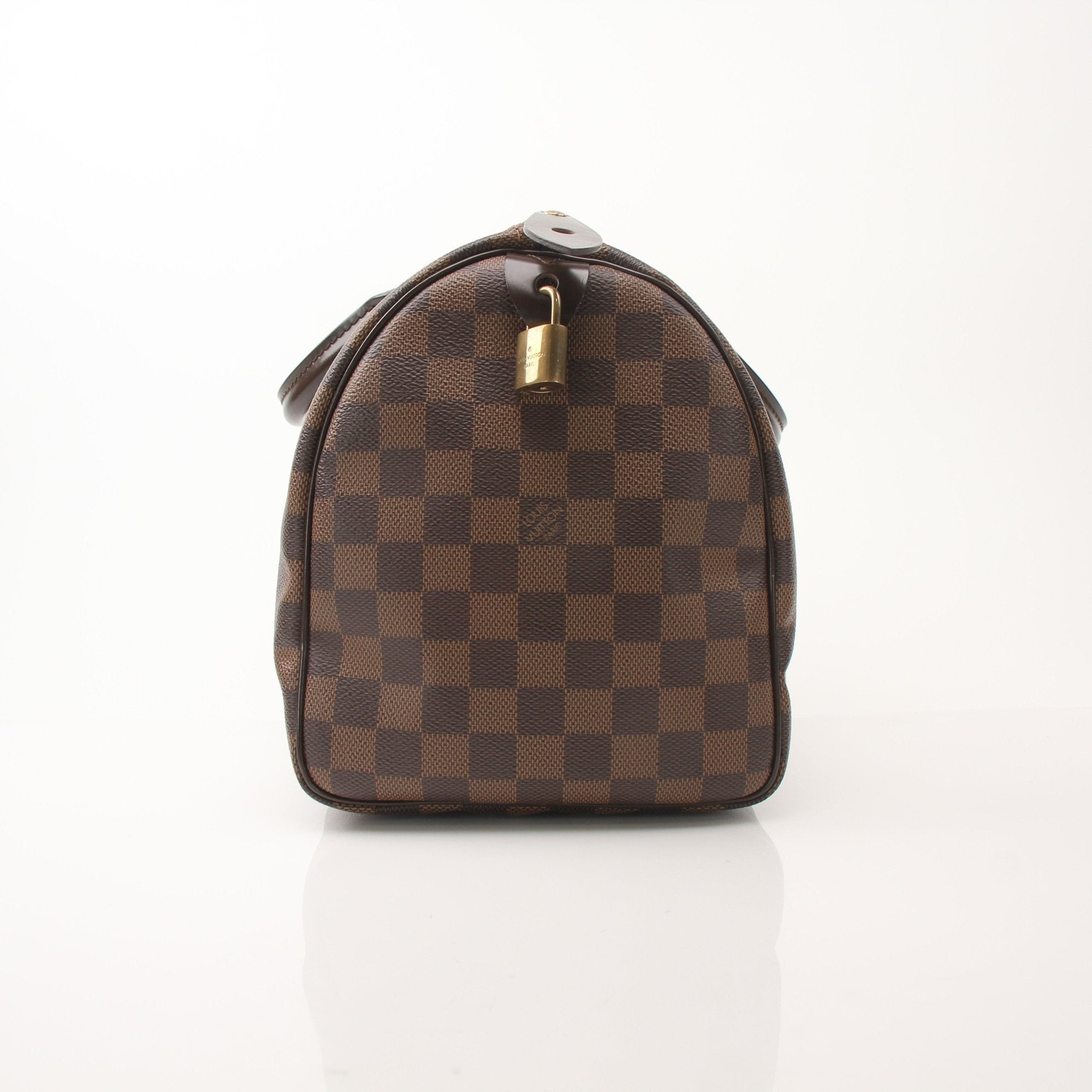Louis Vuitton Speedy 30 handbag with gold hardware, featuring classic monogram canvas and leather trim.