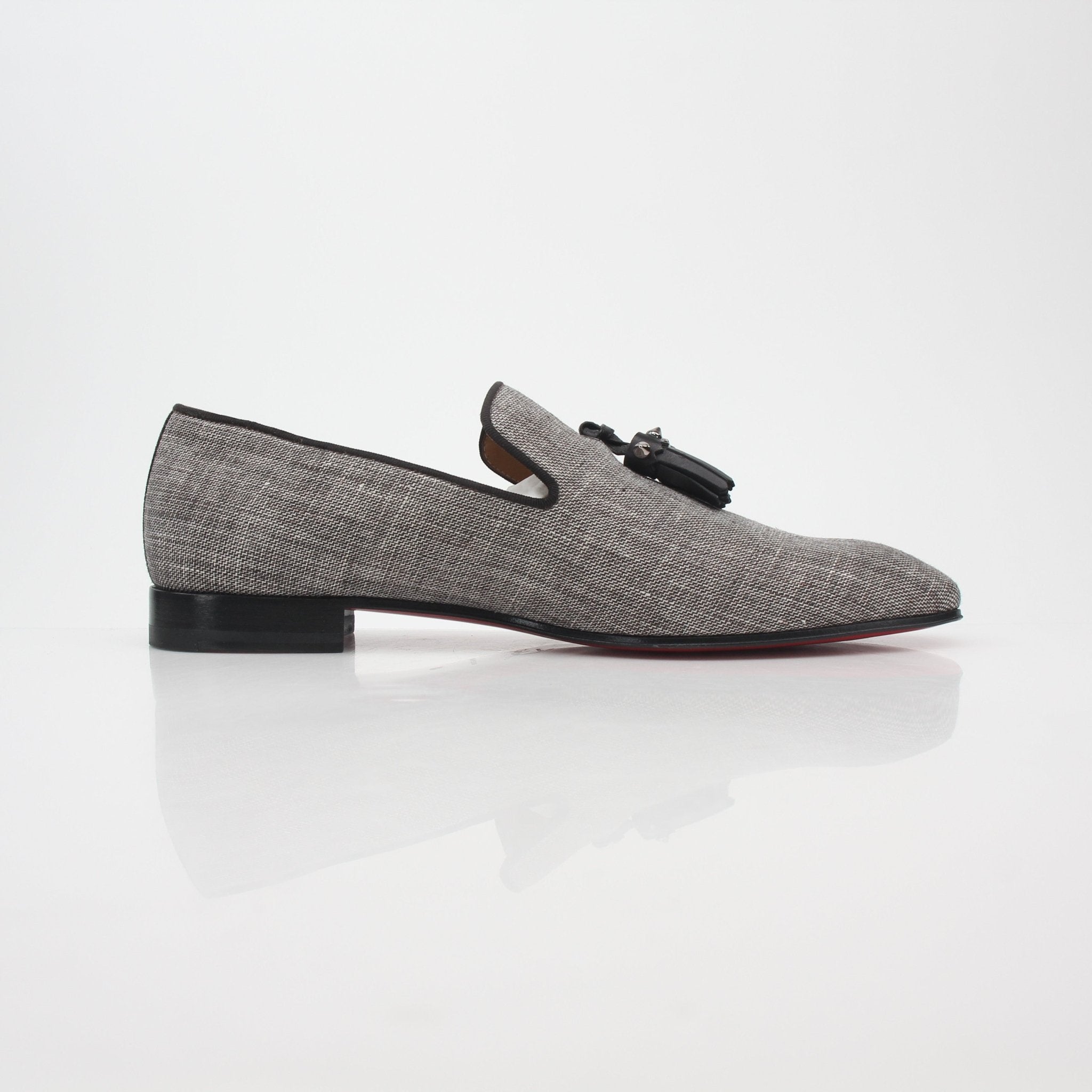 Christian Louboutin gray Dandelion Spikes tassel loafers with spiked embellishments and tassel details, stylish shoe footwear.