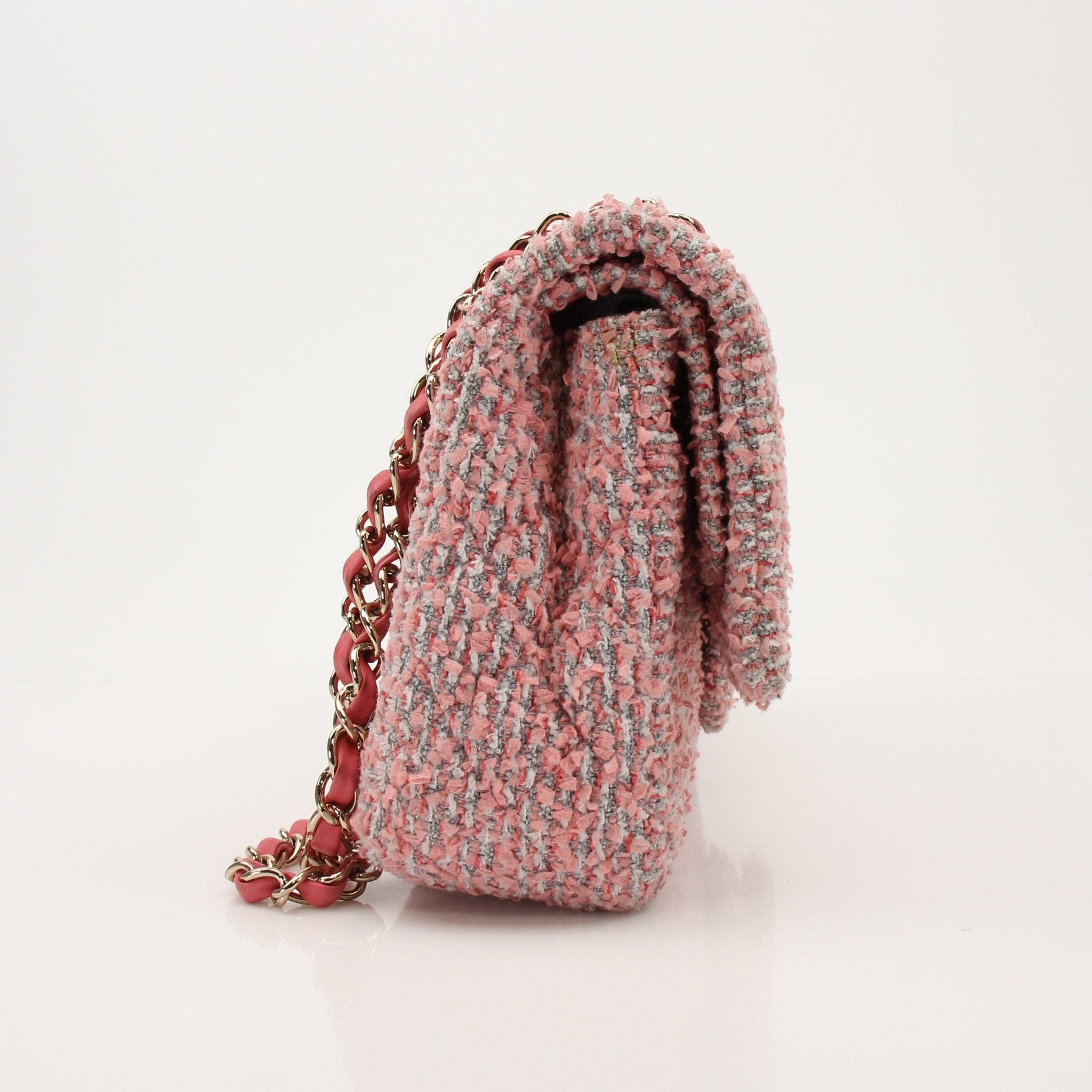 Gold & Beyond Chanel pink tweed flap handbag with gold chain strap and classic quilted design, stylish and elegant accessory.