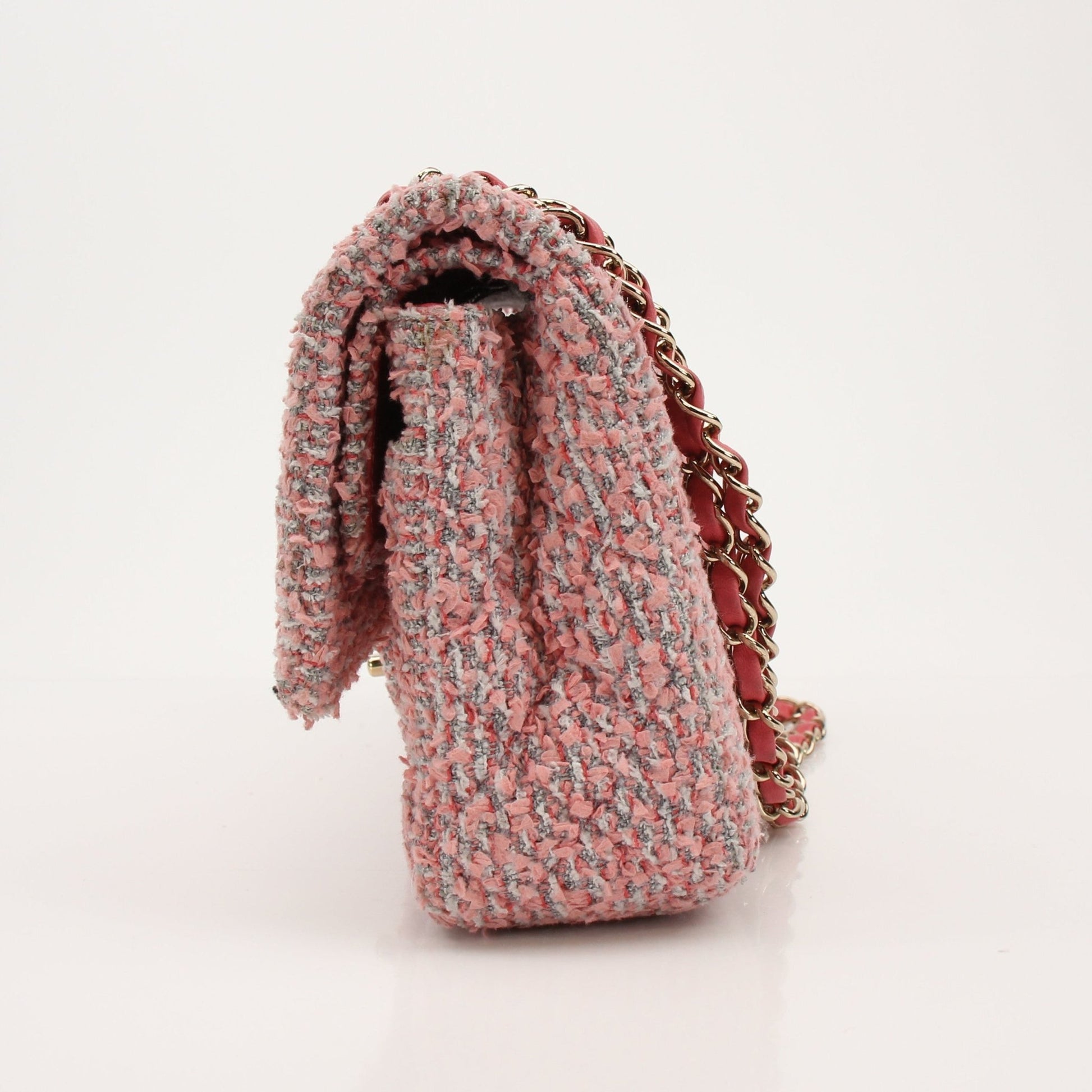 Gold & Beyond Chanel pink tweed flap handbag with gold hardware and signature quilted design.