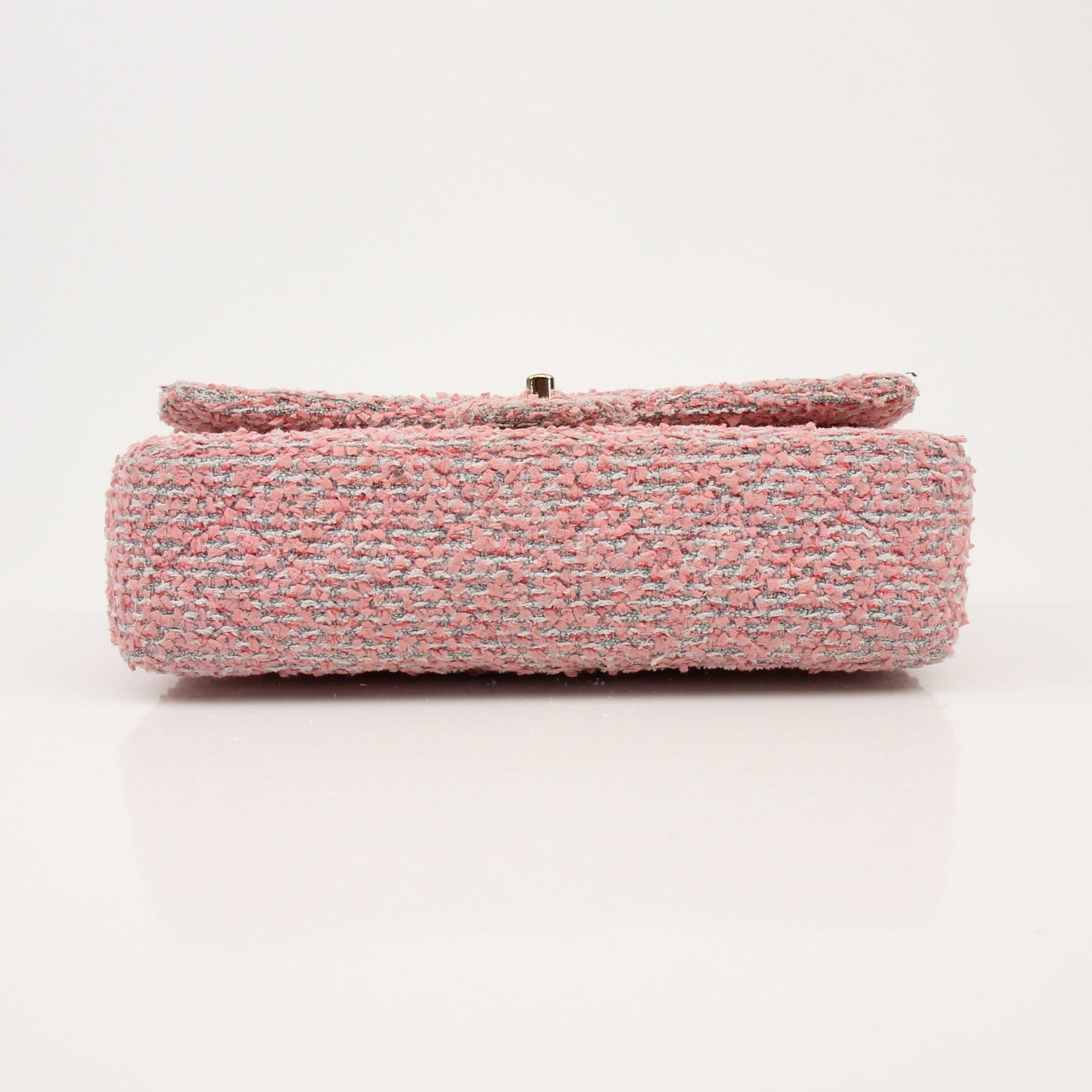 Gold & Beyond Chanel pink tweed flap handbag with gold accents and classic design, showcasing a stylish and elegant accessory.