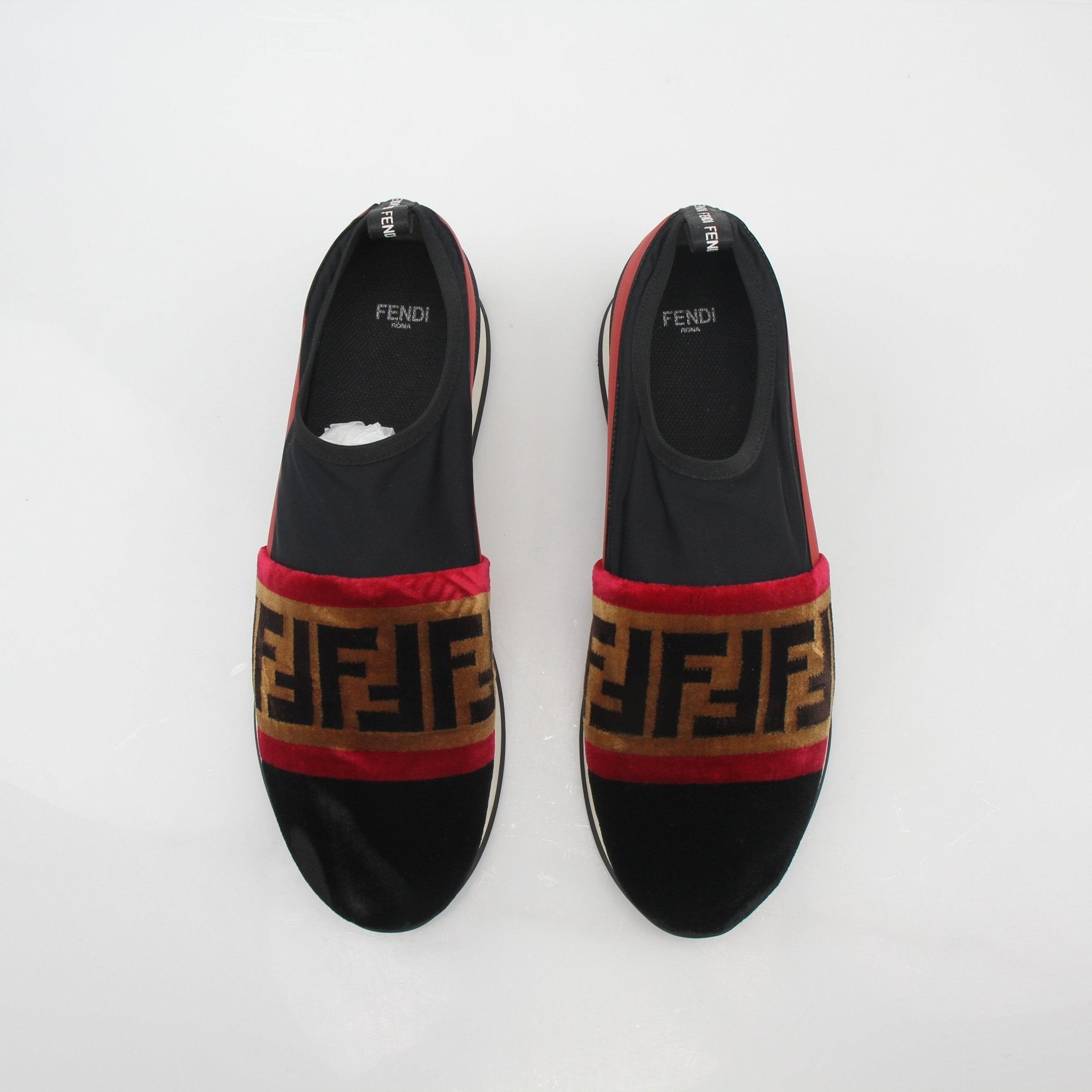 Fendi black and red Zucca FF logo slip-on sneakers with casual shoe design and brand pattern, from Gold & Beyond.