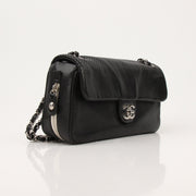 Gold & Beyond Chanel Baseball Spirit Flap Bag handbag with logo detail and structured design on a plain background.