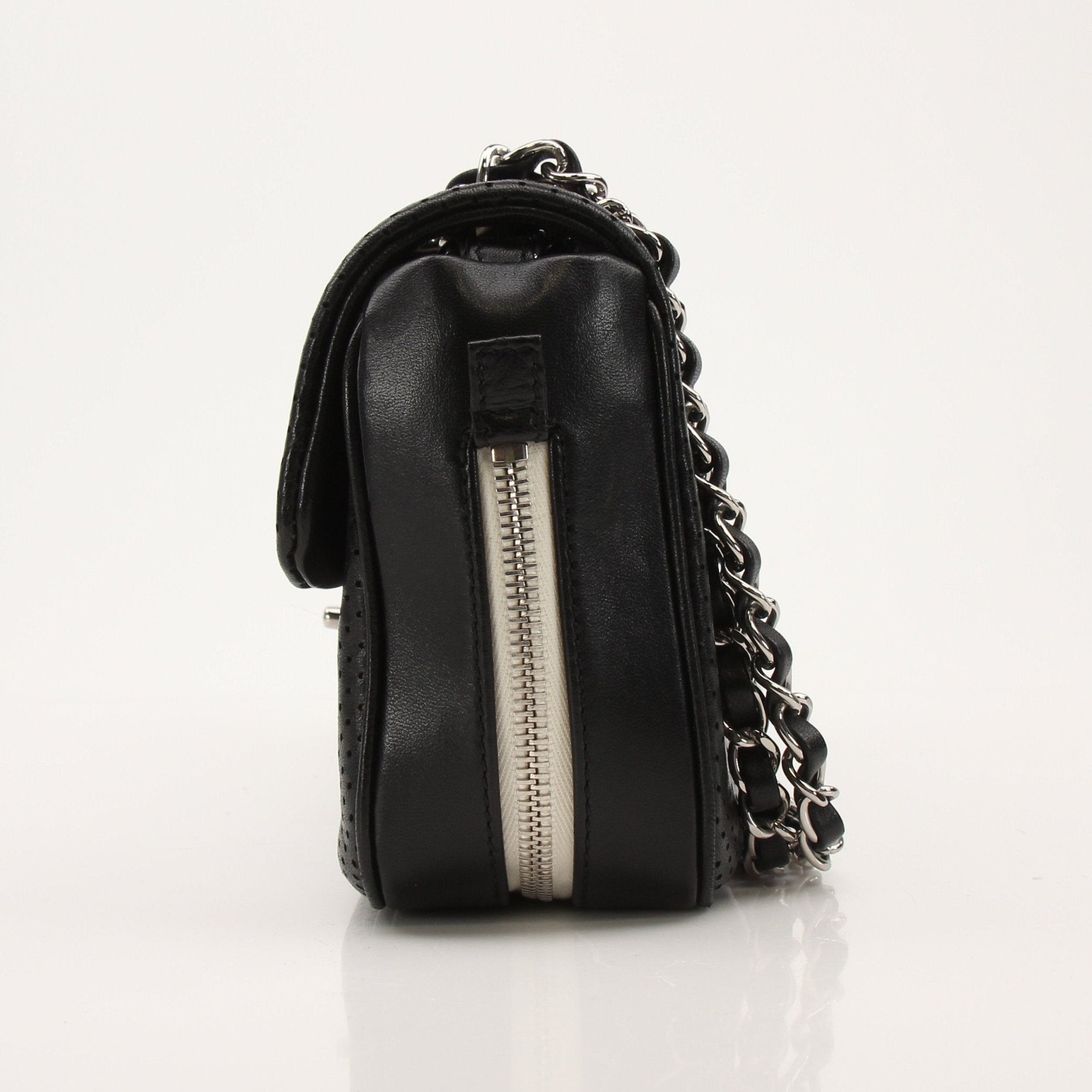 Gold & Beyond Chanel Baseball Spirit Flap Bag handbag with gold accents and logo details shown in the image.