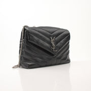 Saint Laurent LouLou medium black leather chain handbag with gold hardware and structured design, featuring a sleek, elegant look.