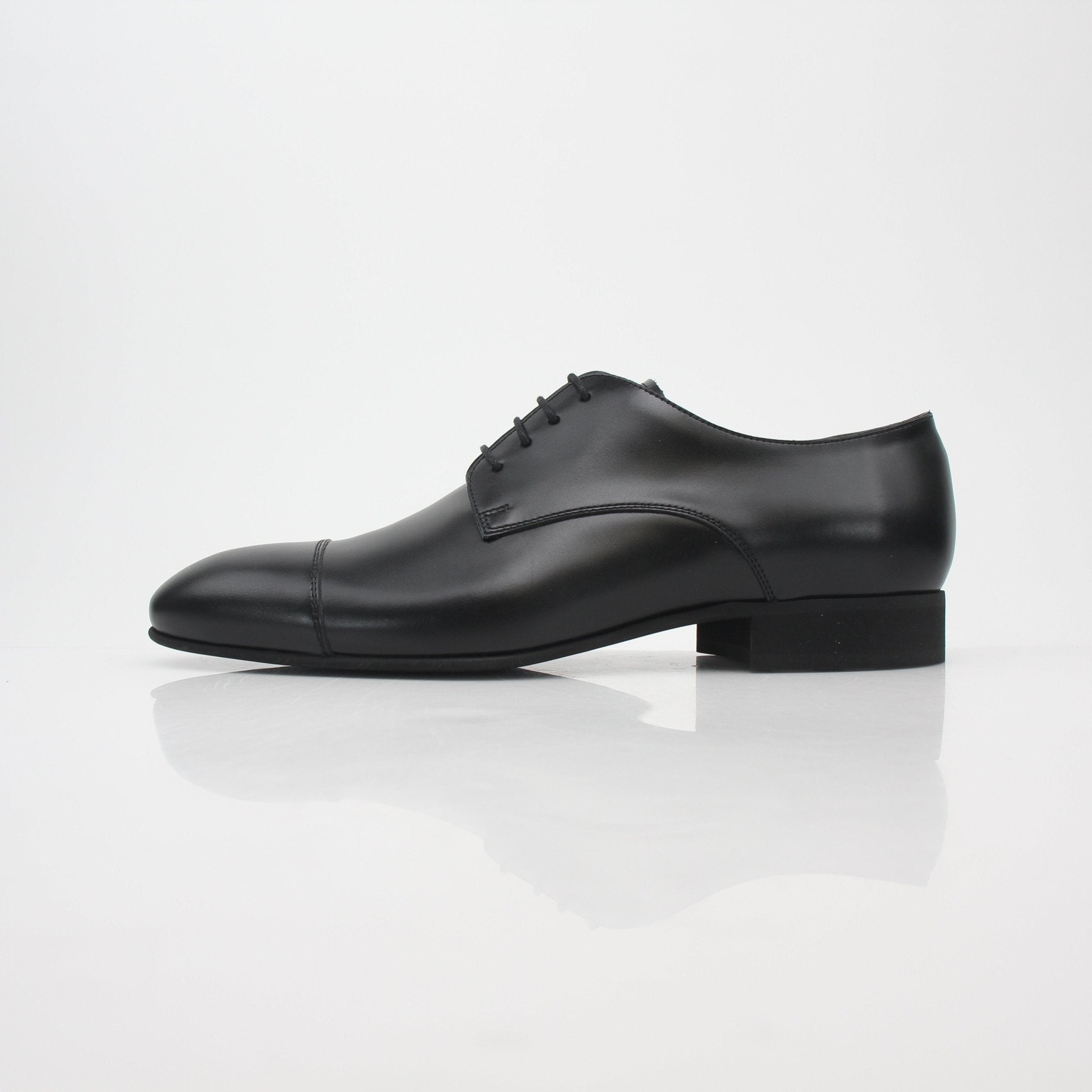 Gold & Beyond Chanel Uniform black leather Derby shoes with cap-toe design, stylish and polished for formal or casual wear.