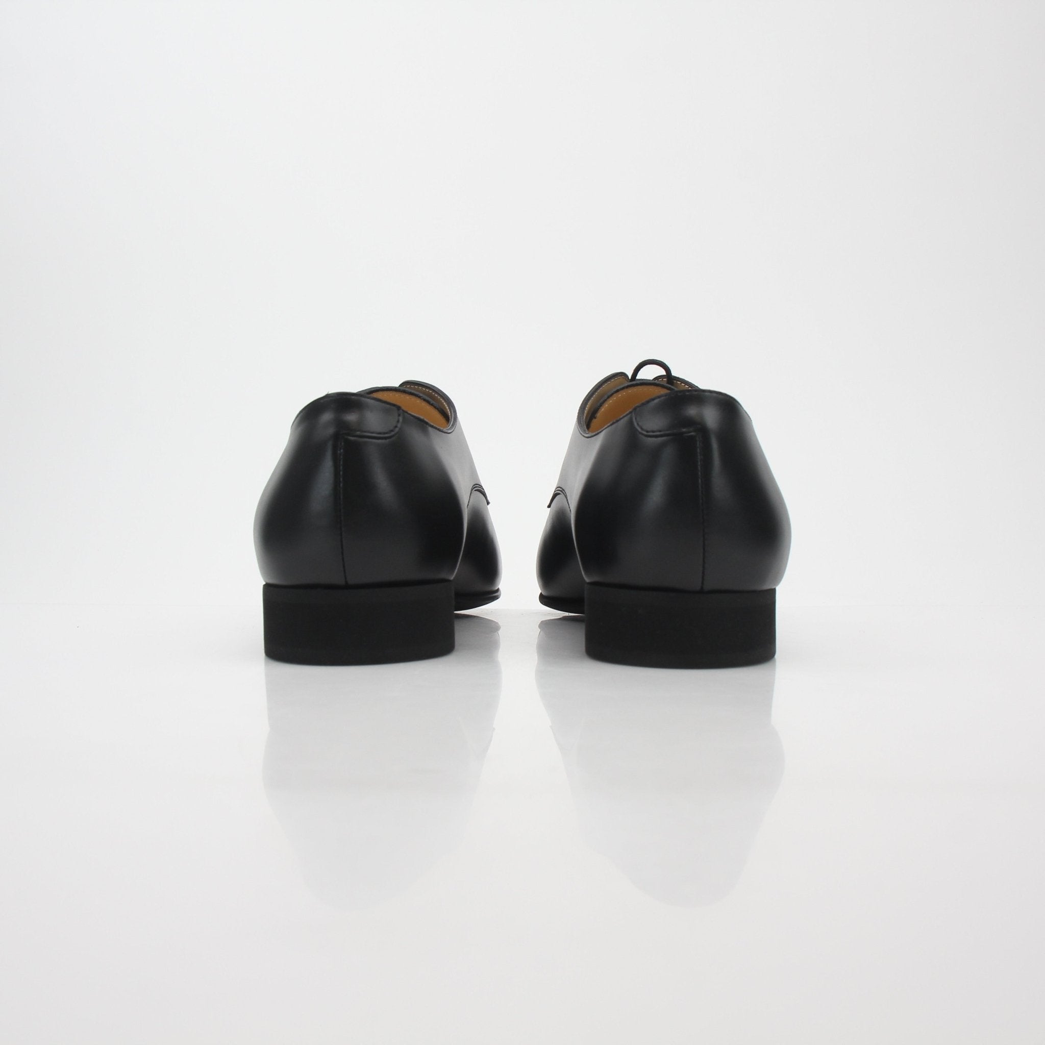 Gold & Beyond Chanel Black Leather Cap-Toe Derby Shoes, stylish men's shoes with sleek leather finish and classic design.