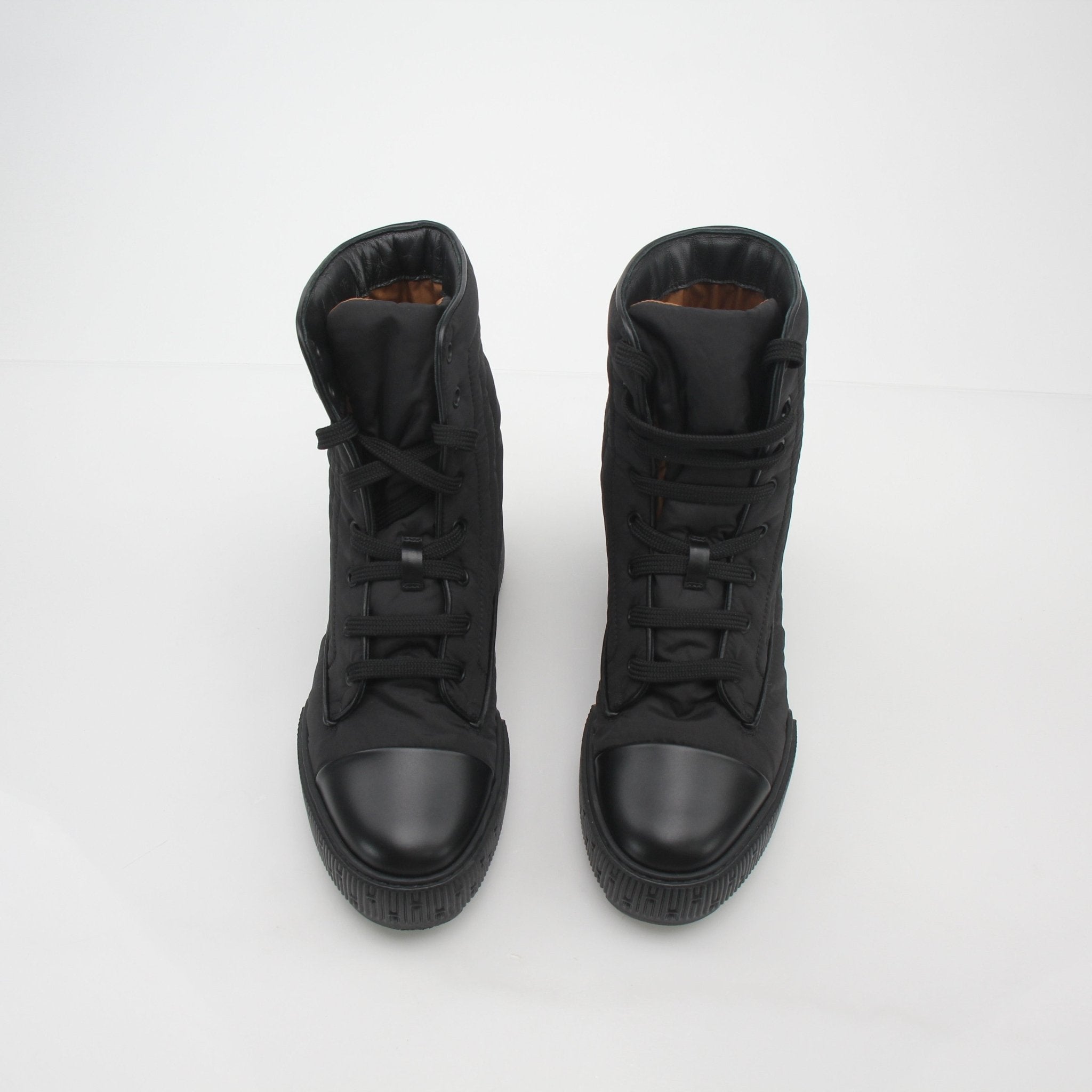 Black Hermès Fresh lace-up ankle boots with sleek design, crafted by Gold & Beyond, shown on a clean white background.