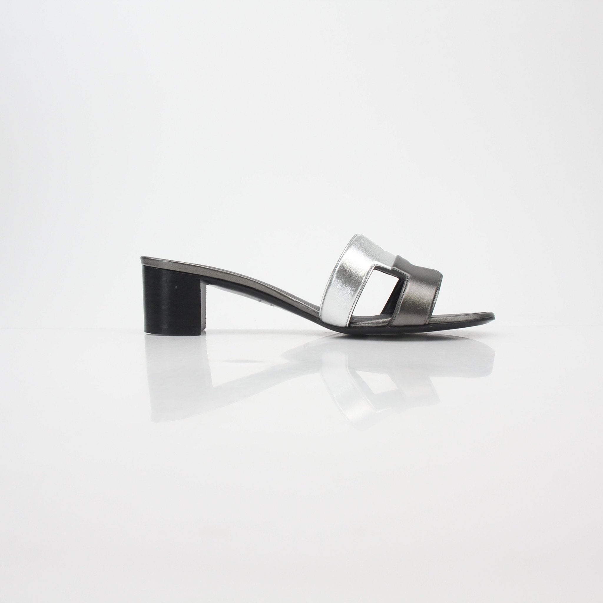 Hermès Metallic Silver Oasis sandals by Gold & Beyond, stylish silver shoes with metallic finish and open-toe design.