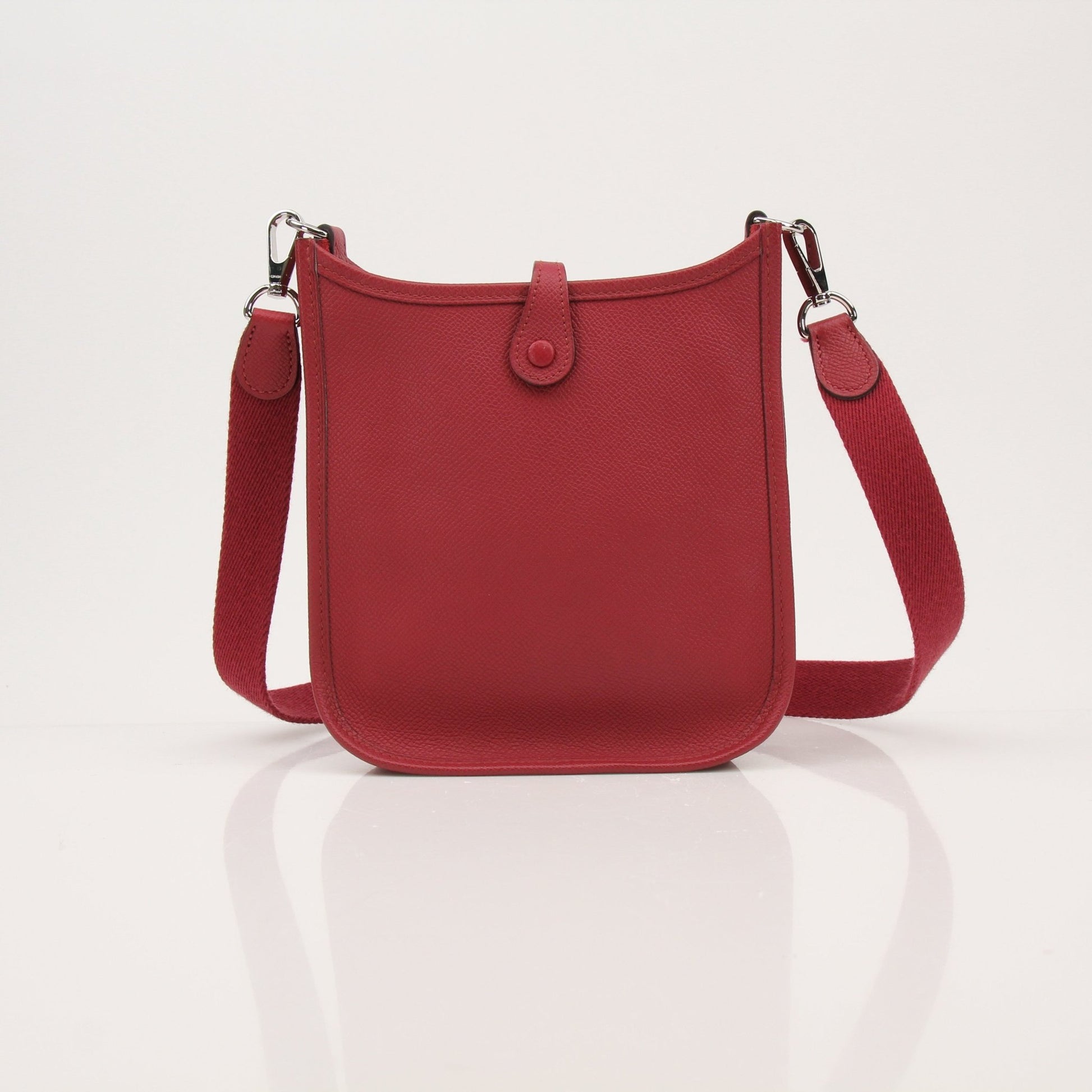 Hermès Evelyne Mini handbag by Gold & Beyond, showcasing the textured leather exterior and signature design details.