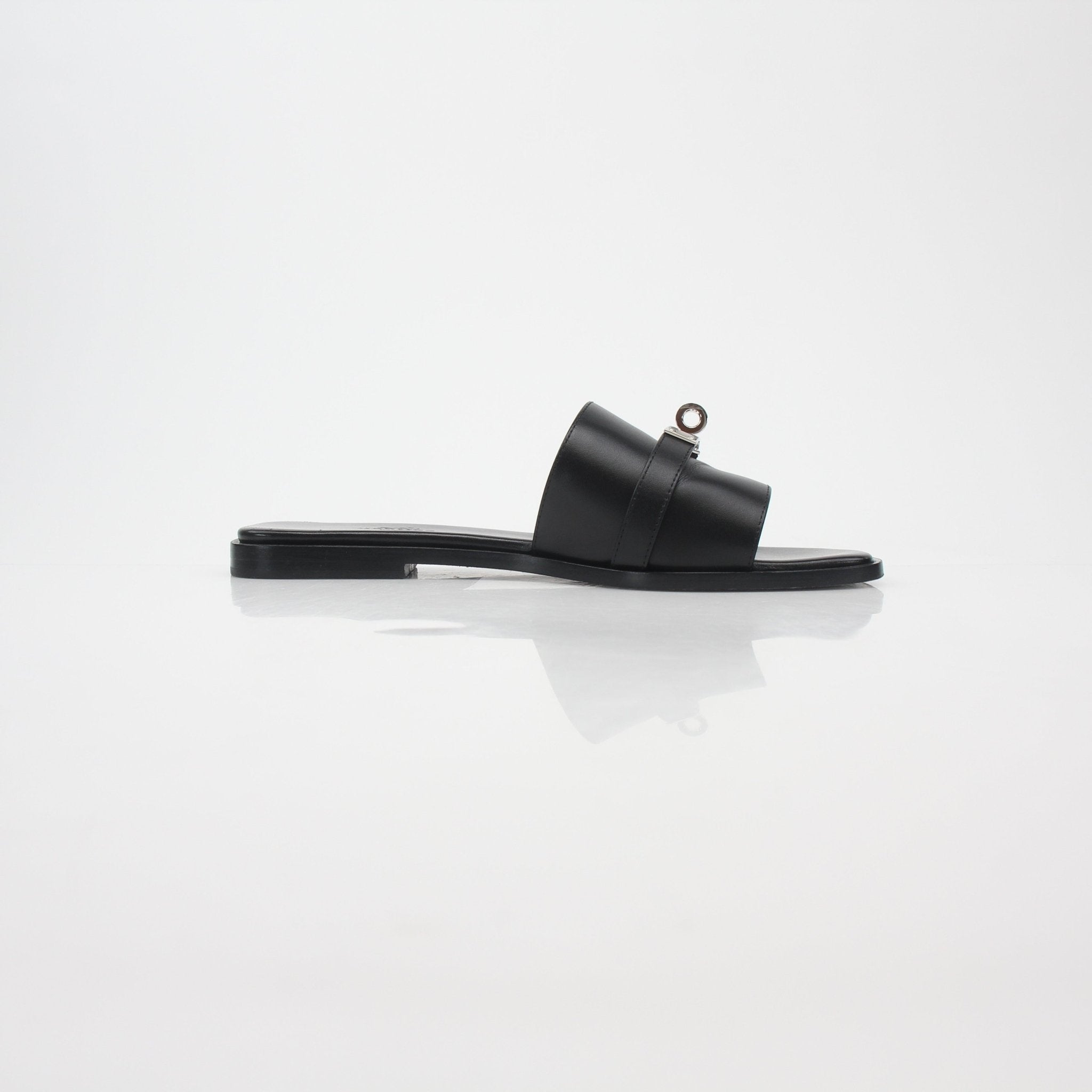 Hermès Black Gabriel leather slide sandals by Gold & Beyond, featuring smooth leather straps and a comfortable flat sole.