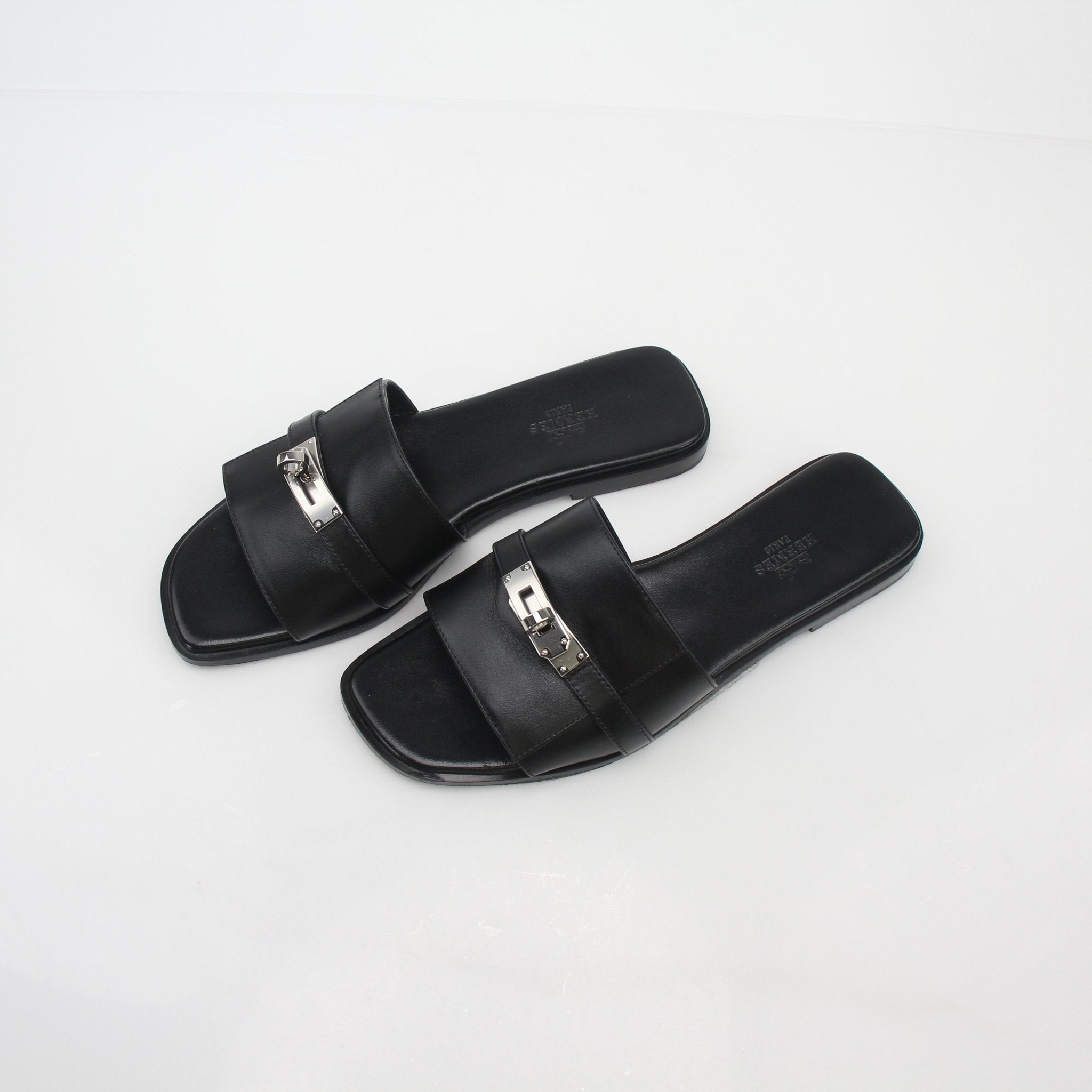 Hermès Black Gabriel leather slide sandals for women, featuring sleek design and comfortable slip-on style.