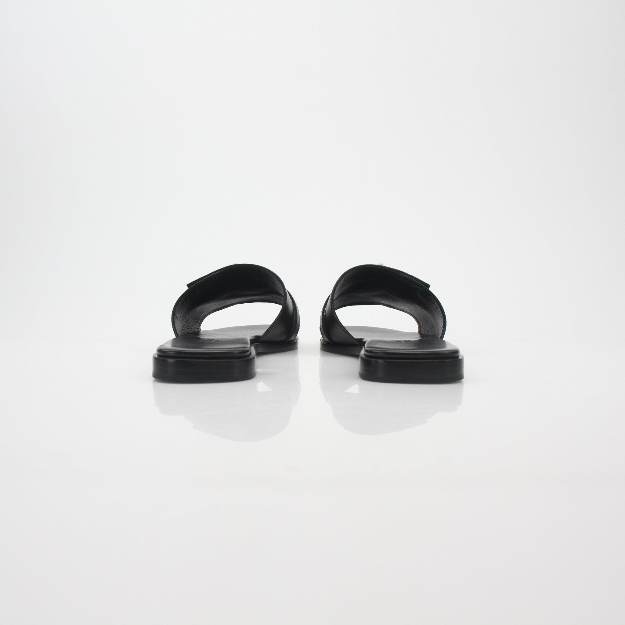 Hermès Black Gabriel leather slide sandals, stylish and comfortable shoes with sleek design and classic brand craftsmanship.