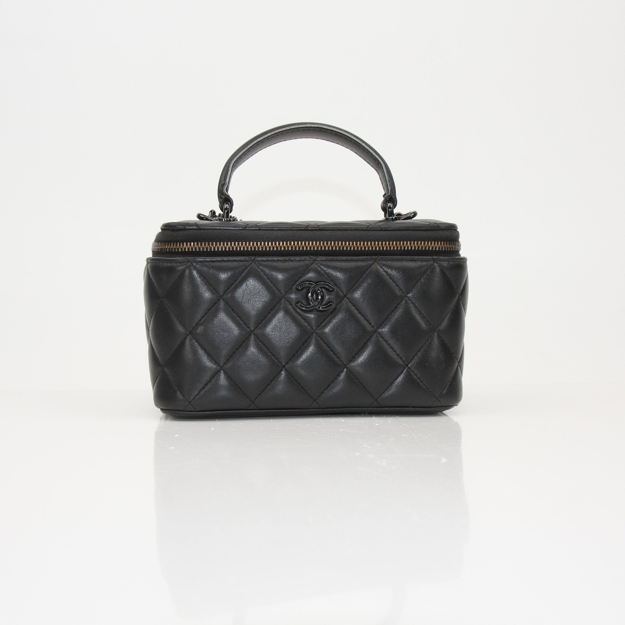 Gold & Beyond Chanel Vanity Bag, a stylish travel bag with a sleek exterior and elegant design, perfect for organizing essentials.