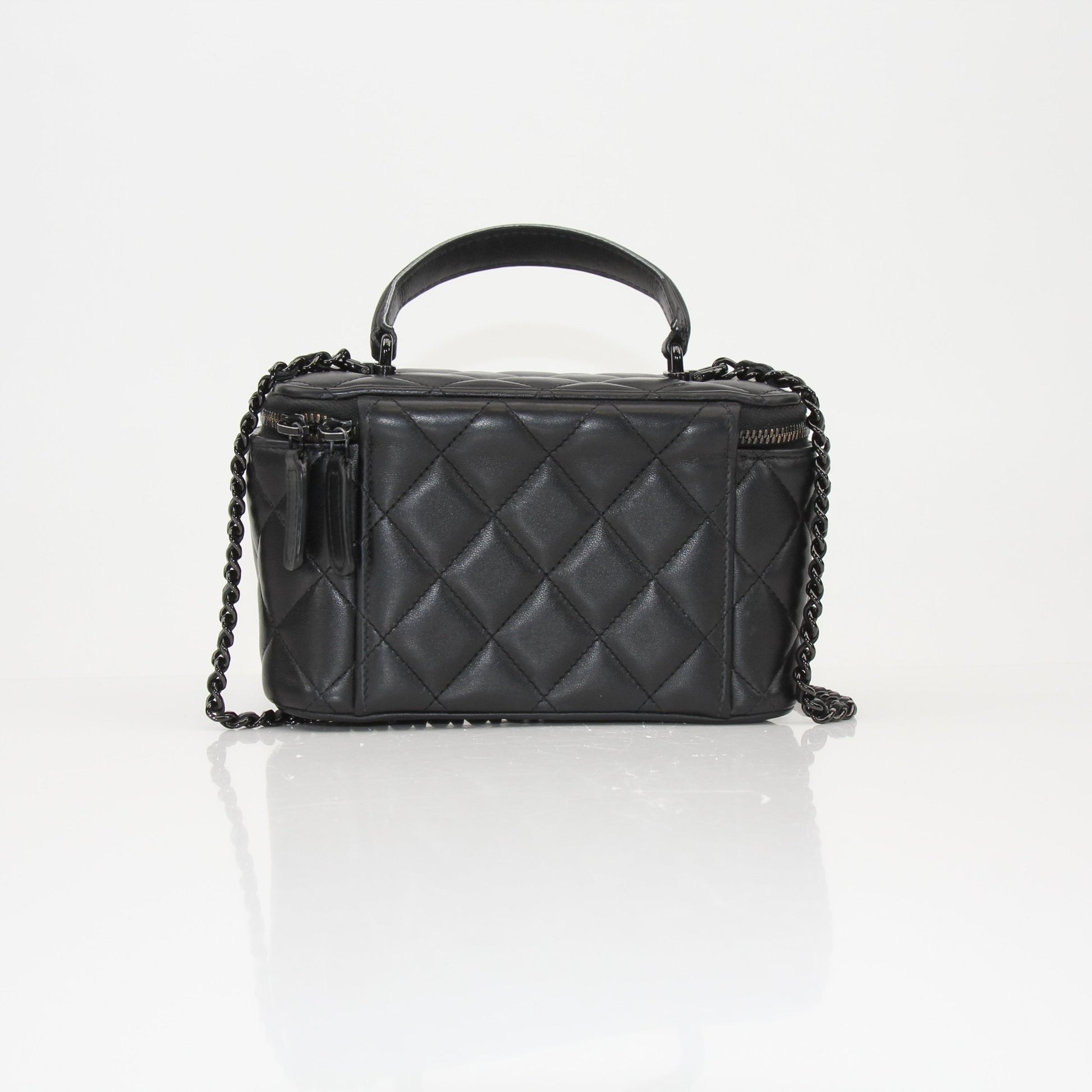 Gold & Beyond Chanel Vanity Bag for travel, featuring a sleek design with compartments for cosmetics and accessories.