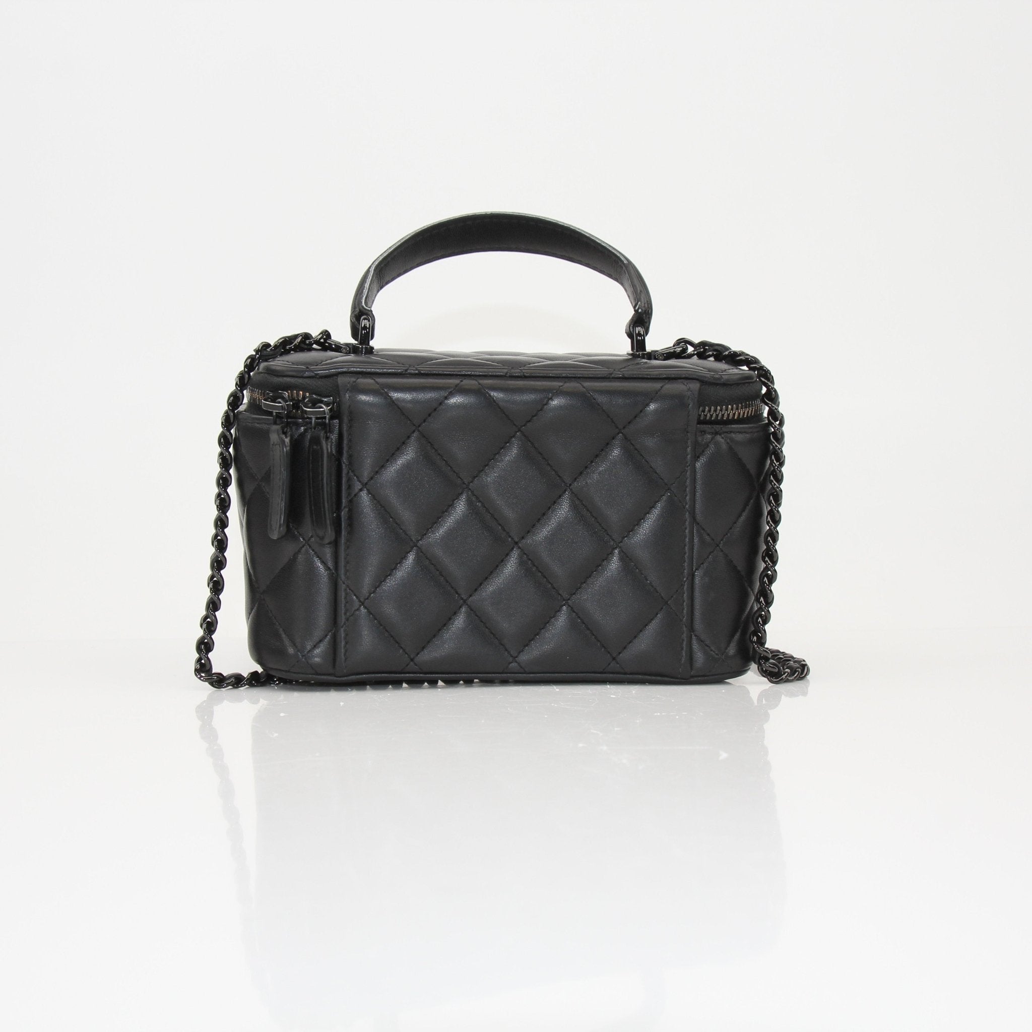 Gold & Beyond Chanel Vanity Bag for travel, featuring a sleek design with compartments for cosmetics and accessories.