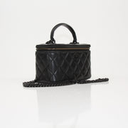 Gold & Beyond Chanel Vanity Bag for travel, featuring a sleek design with multiple compartments and elegant craftsmanship.