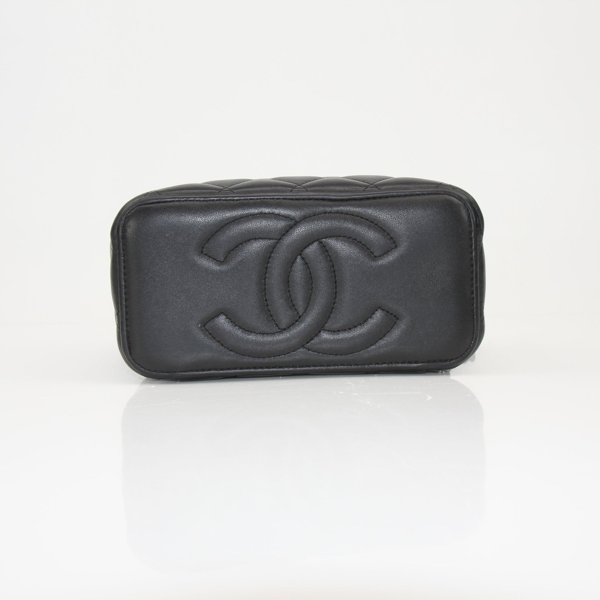 Gold & Beyond Chanel Vanity Bag for travel, stylish black leather with gold-tone hardware and spacious interior.